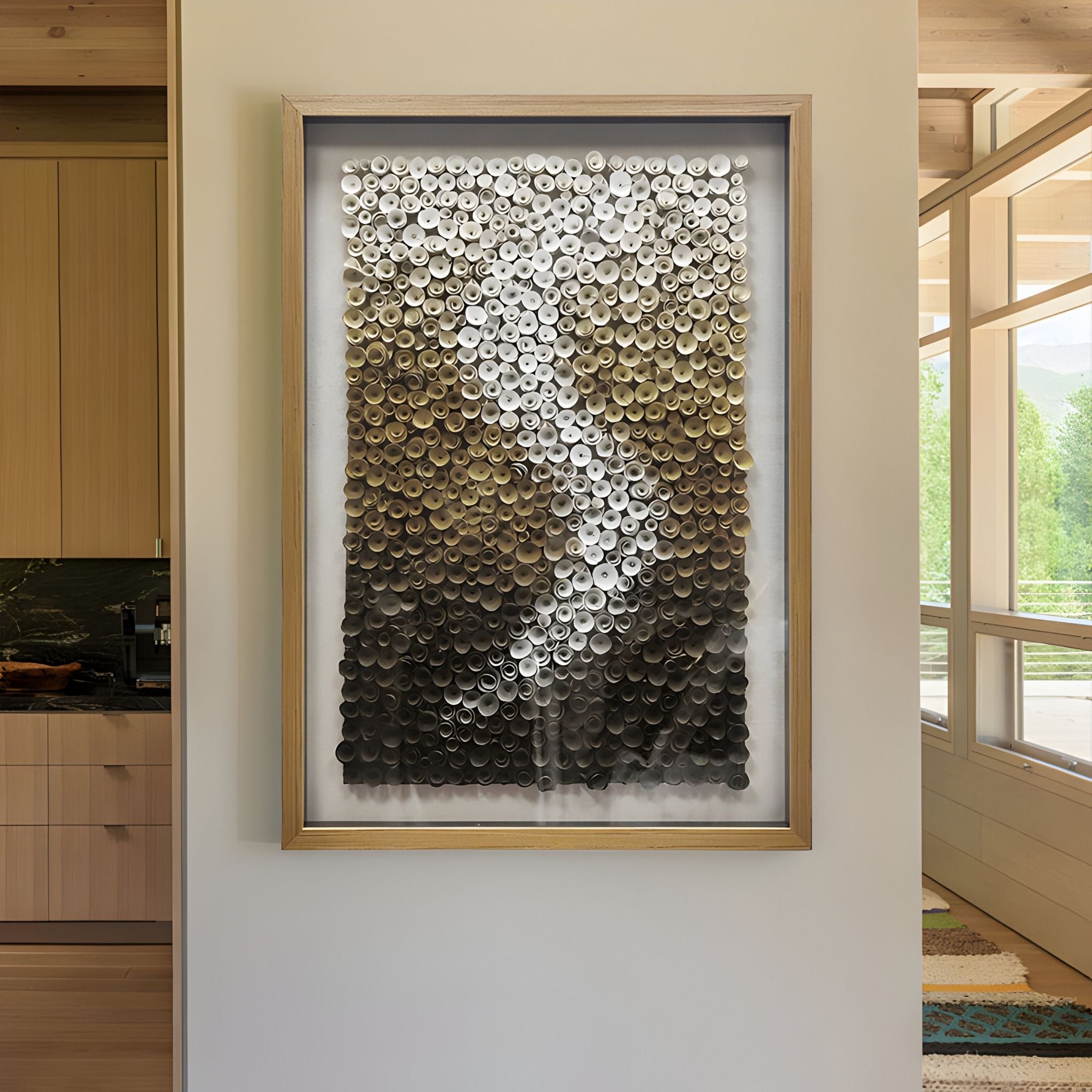 The Spiravale Gold Gradient Floral Curl 3D Wall Art by Giant Sculptures features handmade wood construction and metallic discs in a silver-to-dark bronze gradient, forming a winding vertical design for modern, elegant home decor.