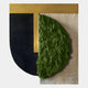 The Halvoria Black & Forest Green Fibre Shield 3D Wall Art by Giant Sculptures showcases geometric forms—a black textured semi-circle, vertical gold rectangle, green half oval—set on a beige and light gray background.