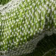 Close-up of Lyronda Green Textured Woven 3D Wall Art by Giant Sculptures, featuring green and white threads in a crisscross pattern for a sculptural, contemporary luxury feel.