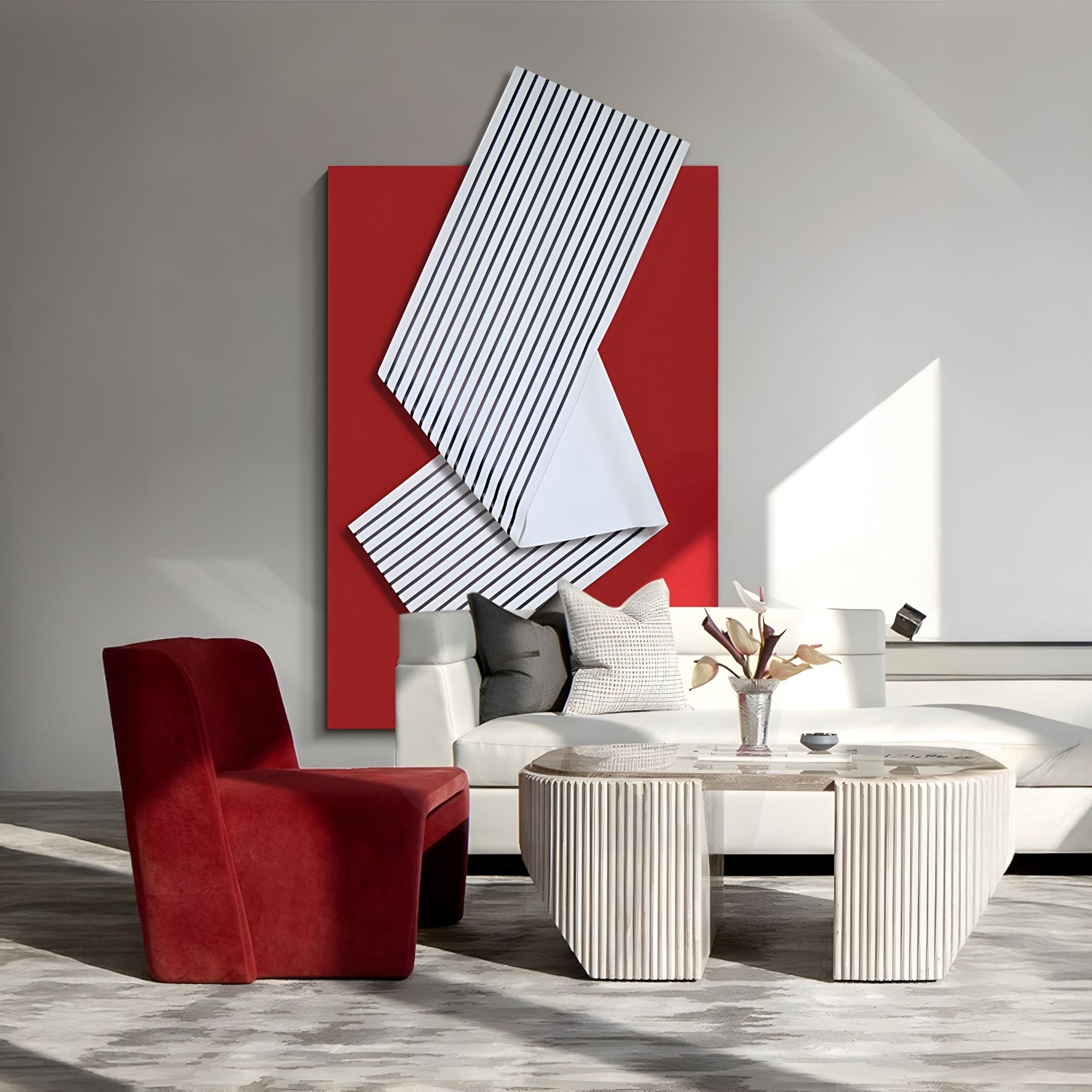 A modern living room with a white sectional, geometric coffee tables, a red velvet chair, and Giant Sculptures’ Arcluma Crimson Stripe Fold Leather 3D Wall Art as a sculptural accent. Sunlight streams in, creating bright patches on the floor.