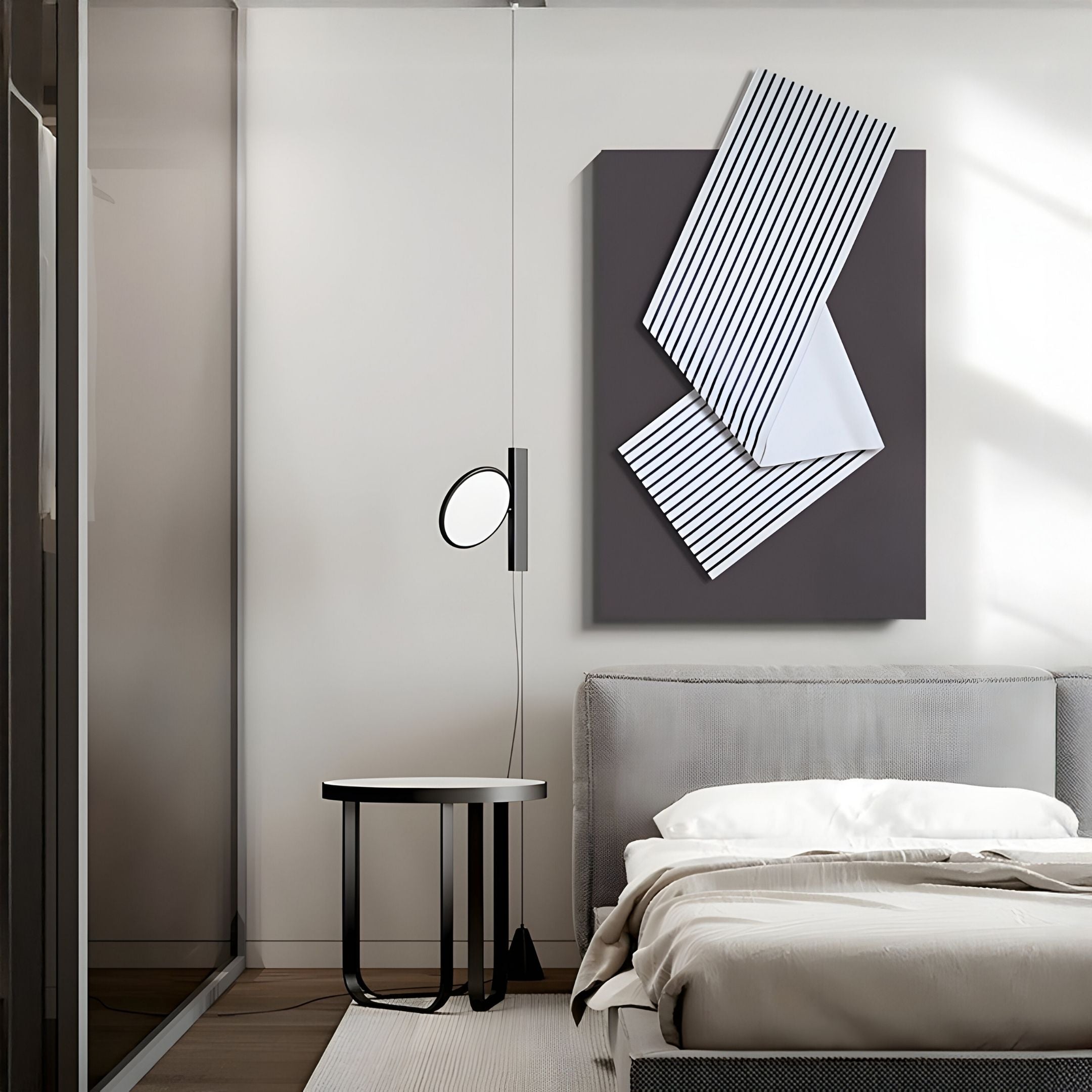 Minimalist bedroom with a gray bed, white bedding, black side table, modern floor lamp, and Giant Sculptures' Arcluma Charcoal Stripe Fold Leather 3D Wall Art featuring black and white stripes on a dark rectangular background.