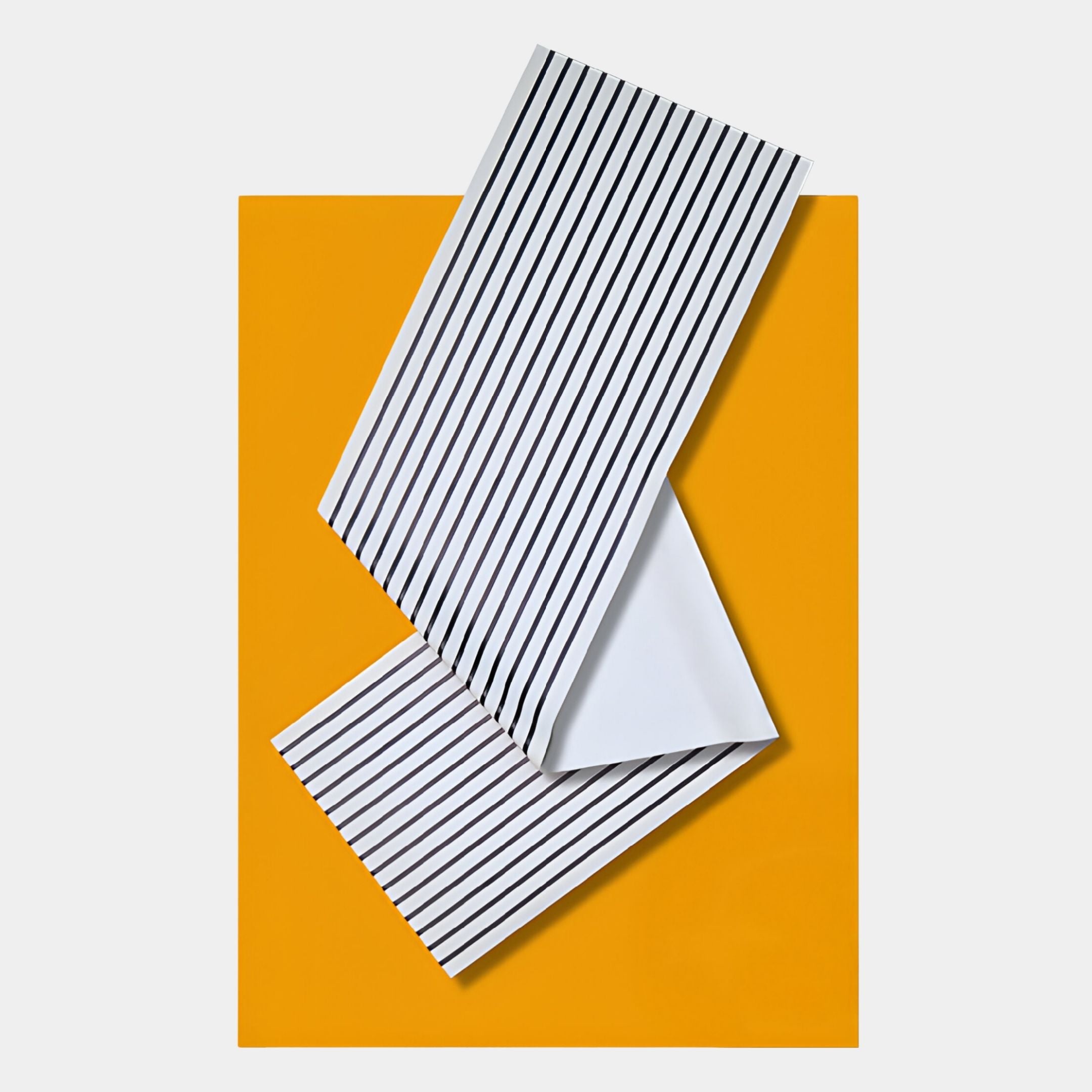 The Arcluma Marigold Stripe Fold Leather 3D Wall Art by Giant Sculptures features overlapping white sheets with black stripes on a yellow background—an ideal minimalist piece for modern contemporary decor.
