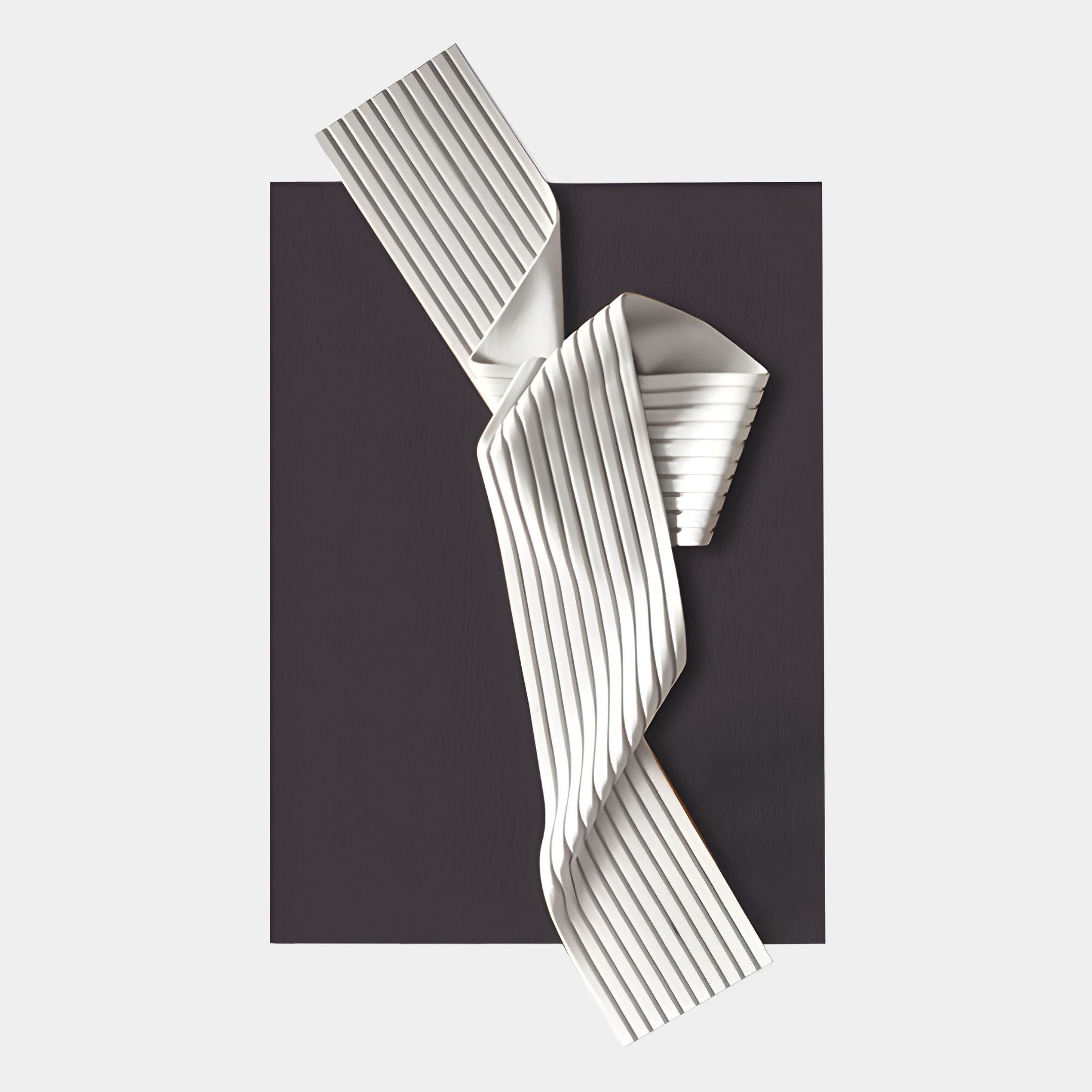 The Arcluma Charcoal Folded Ribbon Leather 3D Wall Art by Giant Sculptures features a striking white, pleated ribbon design crossing a black background, creating bold, minimalist decor for any modern space.