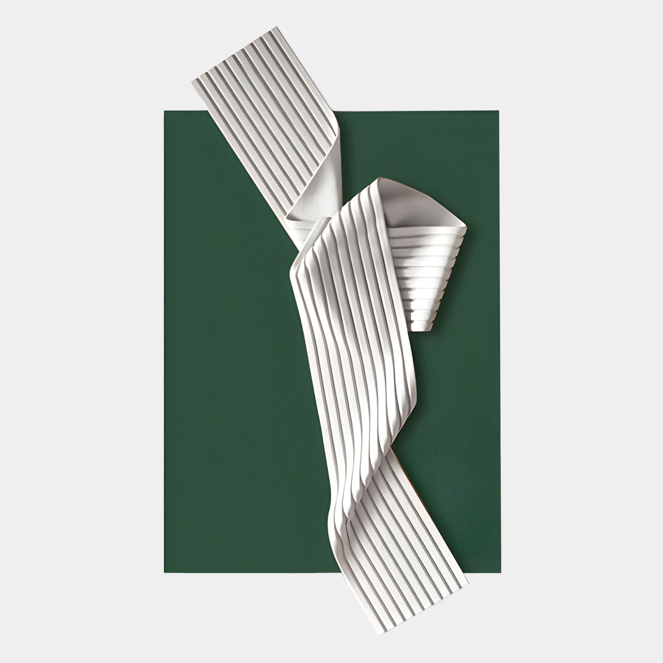 The Arcluma Forest Green Folded Ribbon Leather 3D Wall Art by Giant Sculptures features a white, pleated, ribbon-like form with vertical ridges set against a dark forest green rectangle—an elegant contemporary piece for your wall.