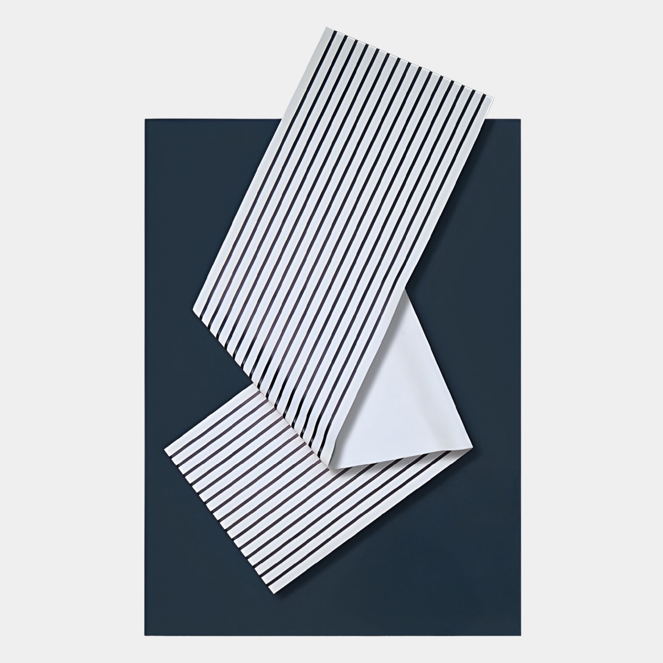 The Arcluma Midnight Blue Stripe Fold Leather 3D Wall Art by Giant Sculptures features folded white leather with black vertical stripes on a dark blue base, offering a minimalist geometric accent for your walls.