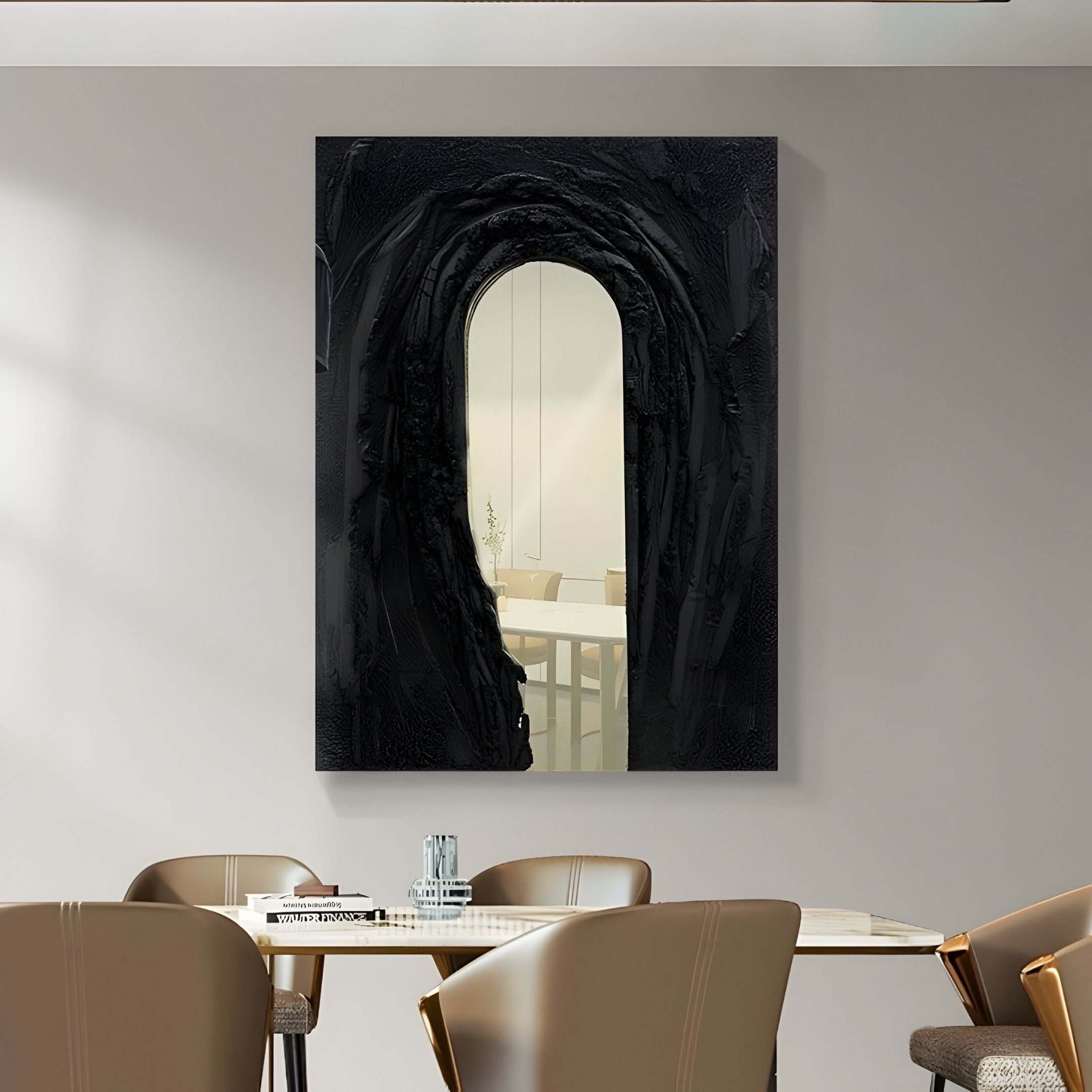 A modern dining area features brown chairs, a white table, and the Arclunor Black Arch Relief Mirror 3D Wall Art by Giant Sculptures on the wall, its textured black frame reflecting bright tables and a decorative vase.