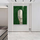A modern hallway with white walls and marble floors features the Giant Sculptures Arclunor Forest Green Arch Relief Mirror 3D Wall Art—an abstract piece with a mirrored center for a striking sculptural effect.