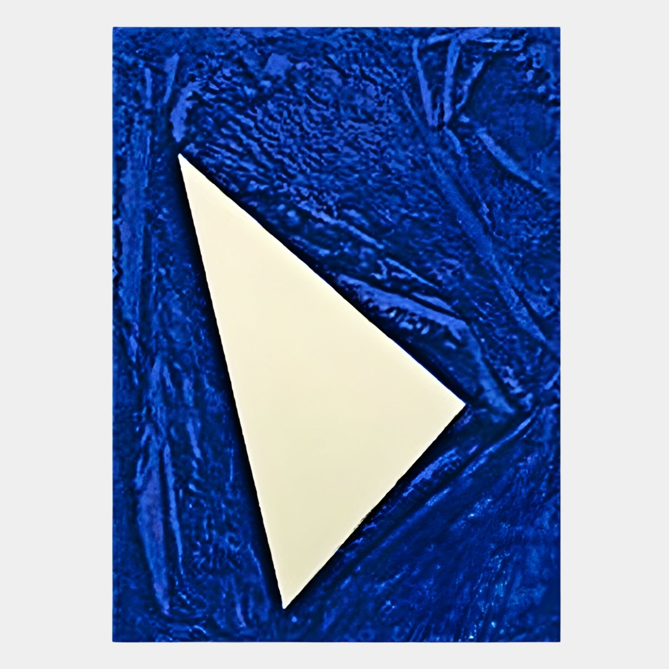 The Arclunor Cobalt Blue Triangle Relief Mirror 3D Wall Art by Giant Sculptures features a white triangular design on a textured deep blue background, serving as a bold geometric accent and unique wall mirror.