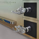 Nexivra Mist Gradient Techscape Interactive 3D Wall Art by Giant Sculptures features two metallic robotic hands on black bases—one open, one gesturing—set against a gradient backdrop, adding a futuristic touch to any gaming room.