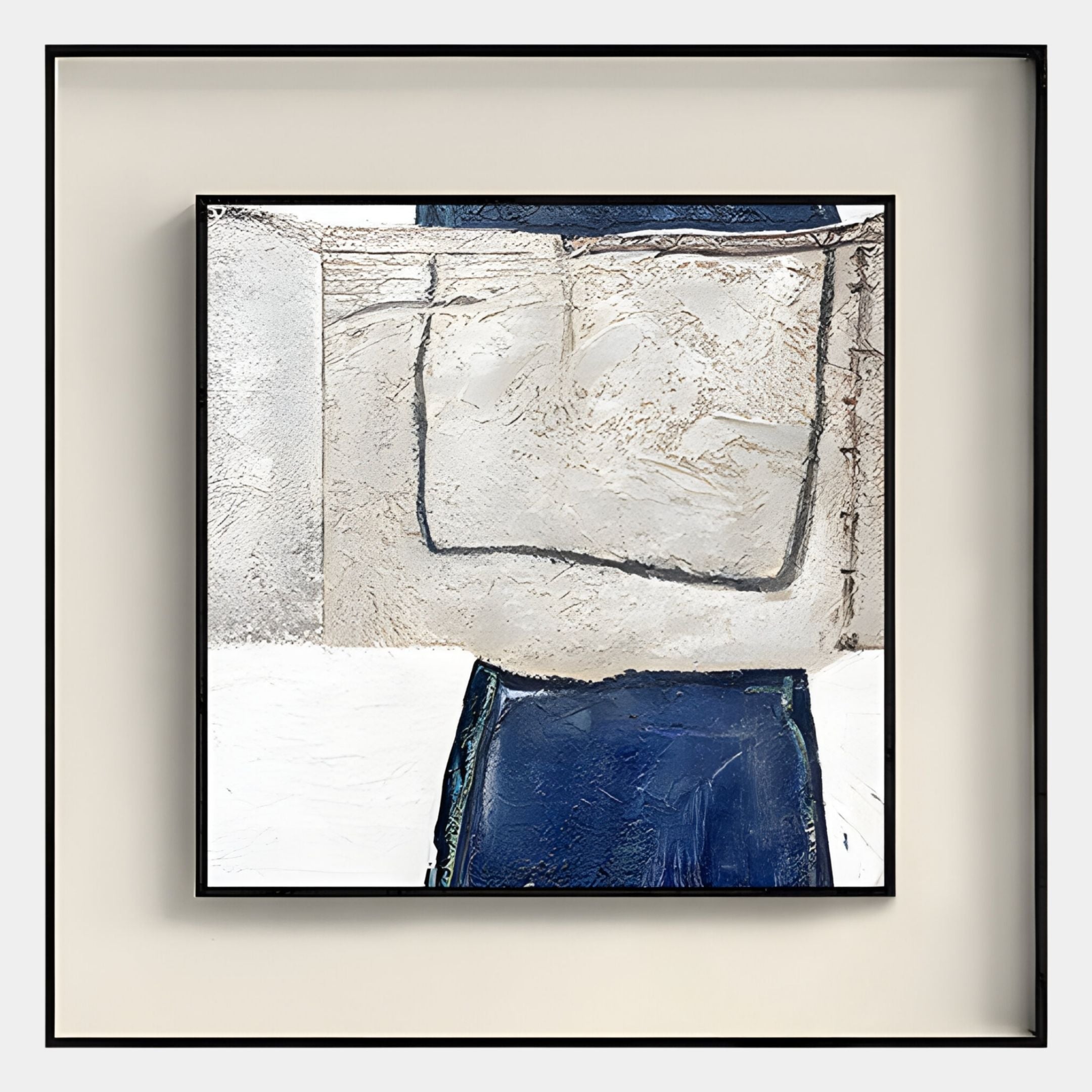 The Aerolith Blue & Ivory Abstract Textured Framed Wall Art by Giant Sculptures features bold navy shapes and textured white-gray areas in a sleek black frame—ideal for modern interiors.