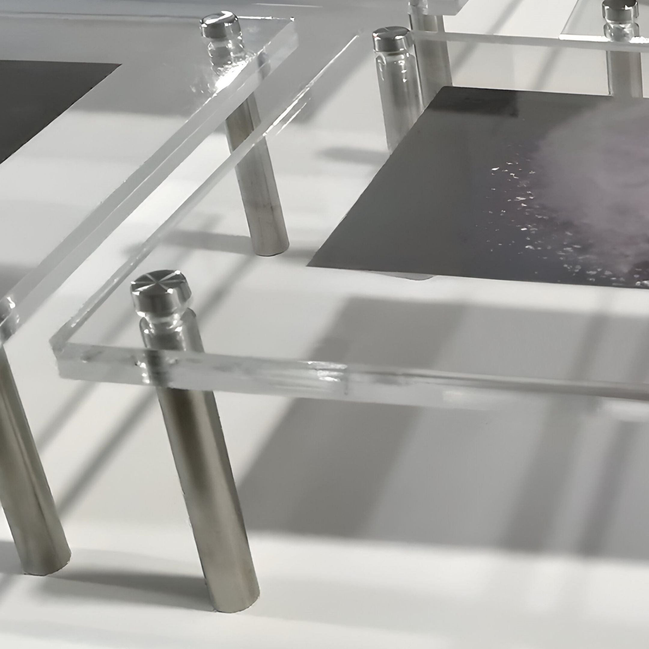 Close-up of Giant Sculptures’ Framegrid Blue Mixed-Size Gallery 12-Set Acrylic Wall Art—clear acrylic panels on metal legs, each displaying a print with abstract designs, ideal for contemporary interiors.