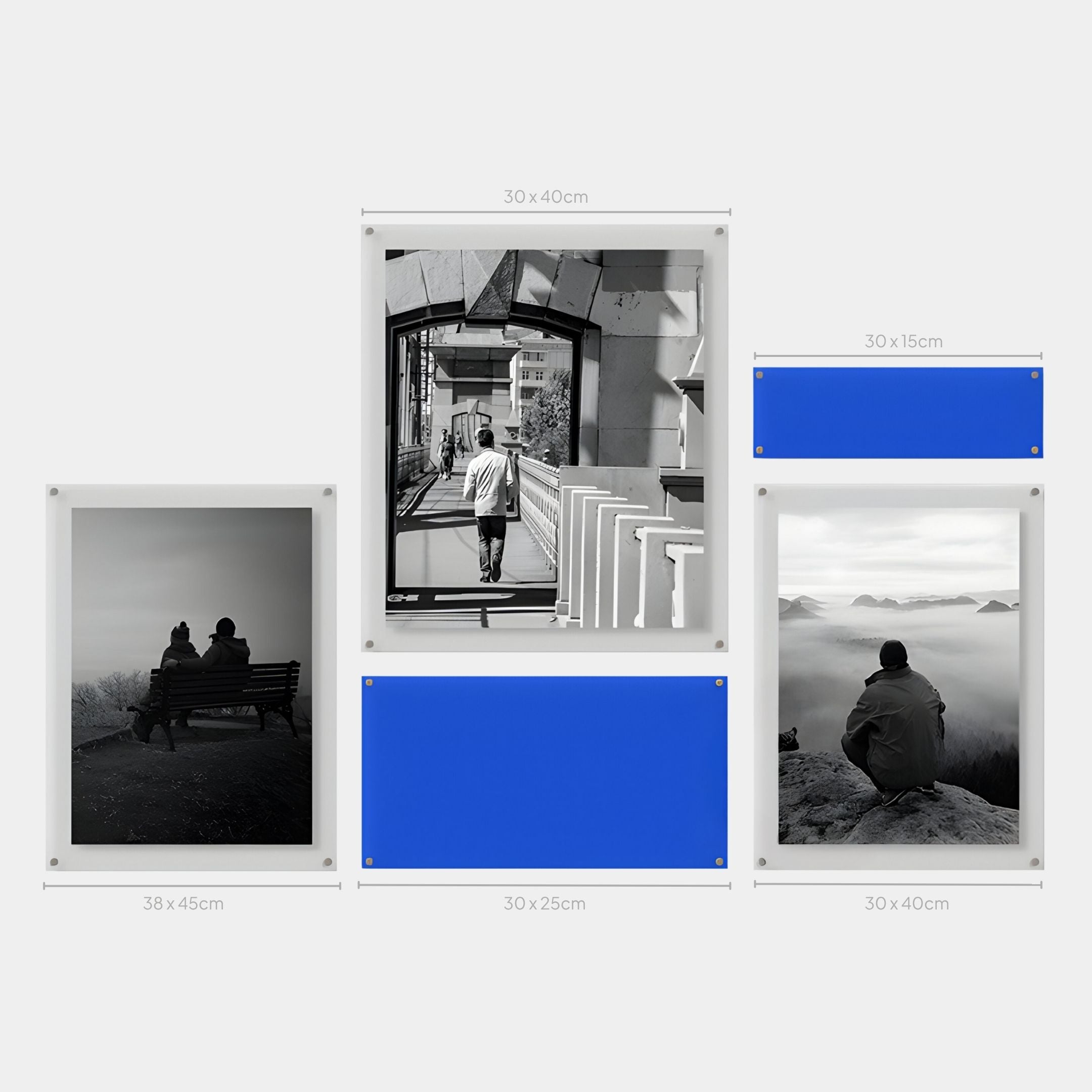 The Giant Sculptures Framegrid Blue Mixed-Size Gallery 5-Set Acrylic Wall Art features five clearly labeled frames with black-and-white photos and blue placeholders, ideal for minimalist decor on a white wall.