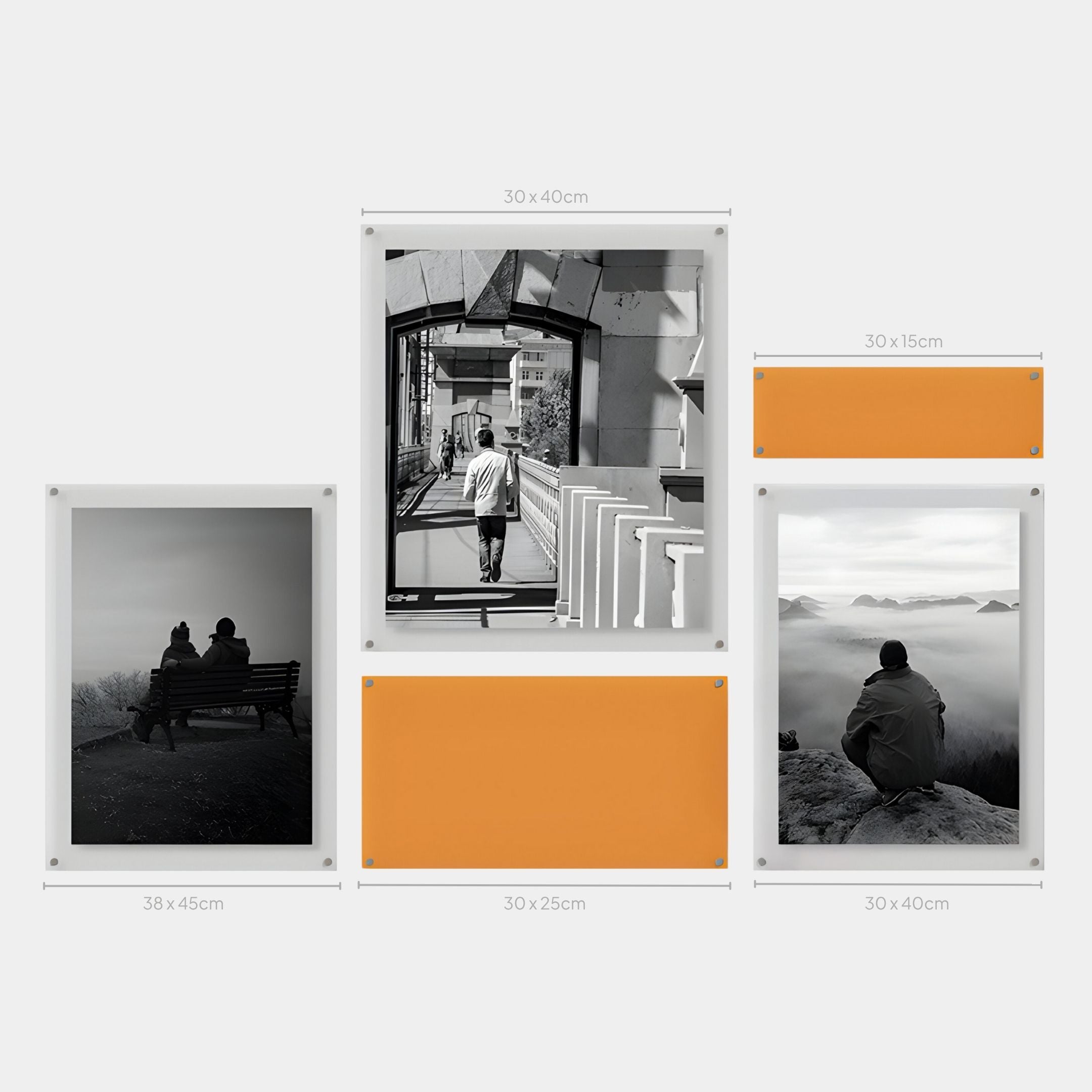 Giant Sculptures' Framegrid Orange Mixed-Size Gallery 5-Set Acrylic Wall Art features three black-and-white portraits and two bold orange panels in labeled frames of various sizes, arranged grid-style for a sleek, modern look.