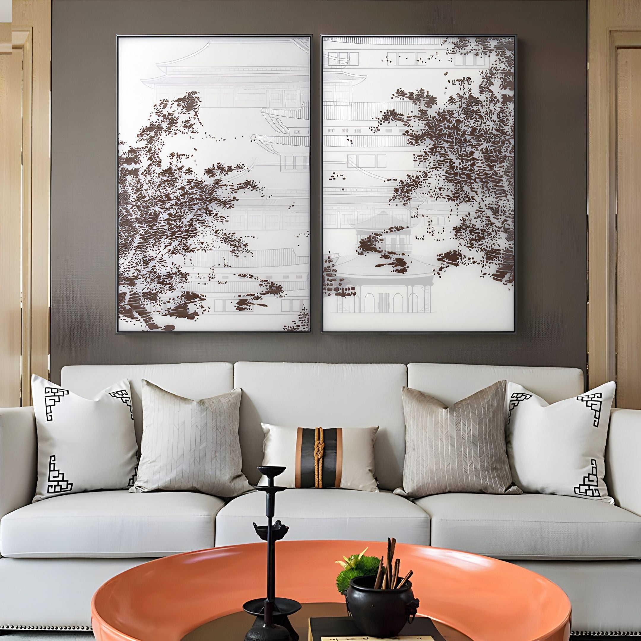 A modern living room features a white sofa with patterned and plain cushions, a round orange coffee table, and two large Kairoshi I Pavilion Architectural Silk Relief 3D Wall Art pieces by Giant Sculptures on the wall behind the sofa.
