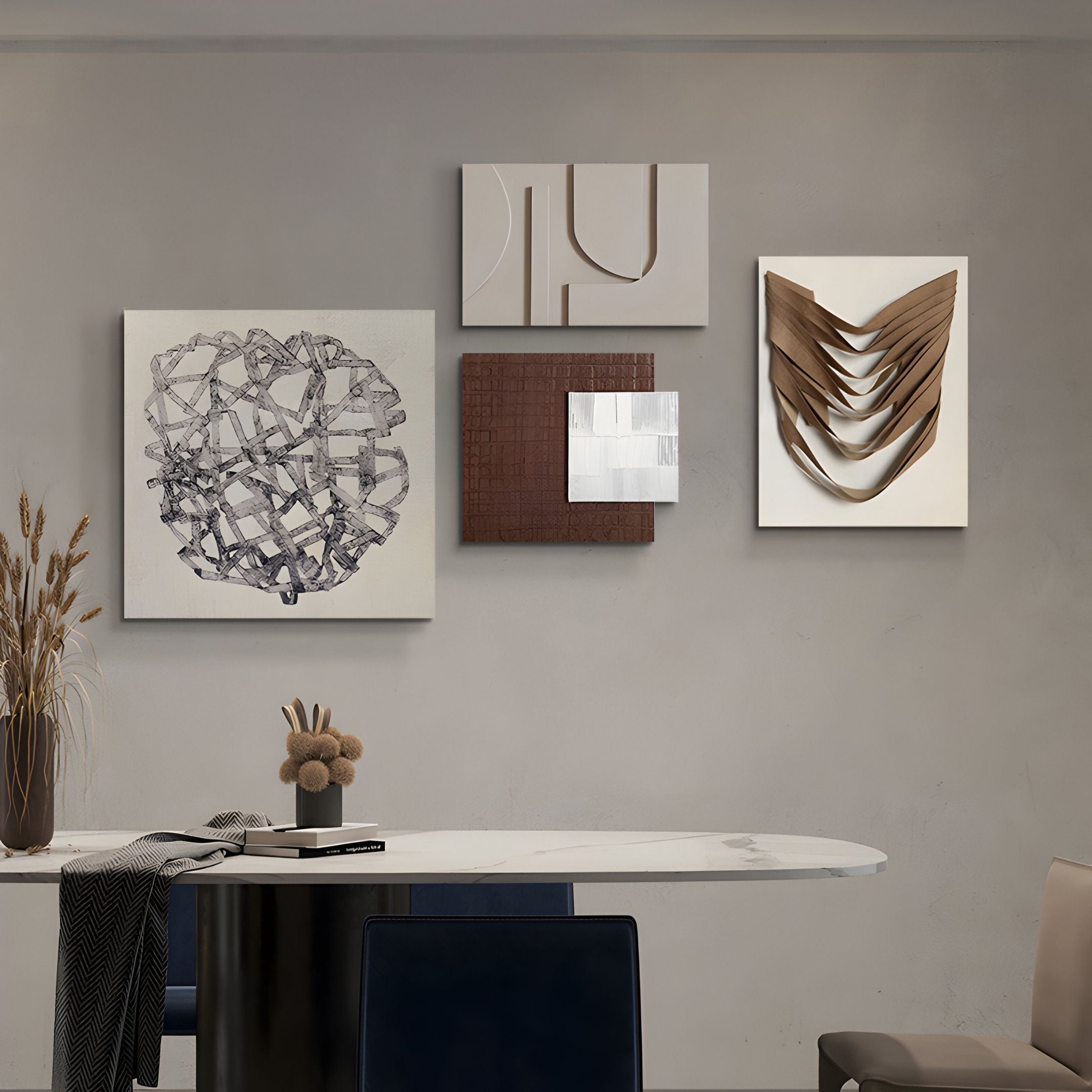 A modern dining area features a marble table, dark chairs, and dried plant decor. The Mirello 4-Set Neutral Sculptural Mixed Media 3D Wall Art by Giant Sculptures enhances the space with stylish, neutral-toned interest above the table.