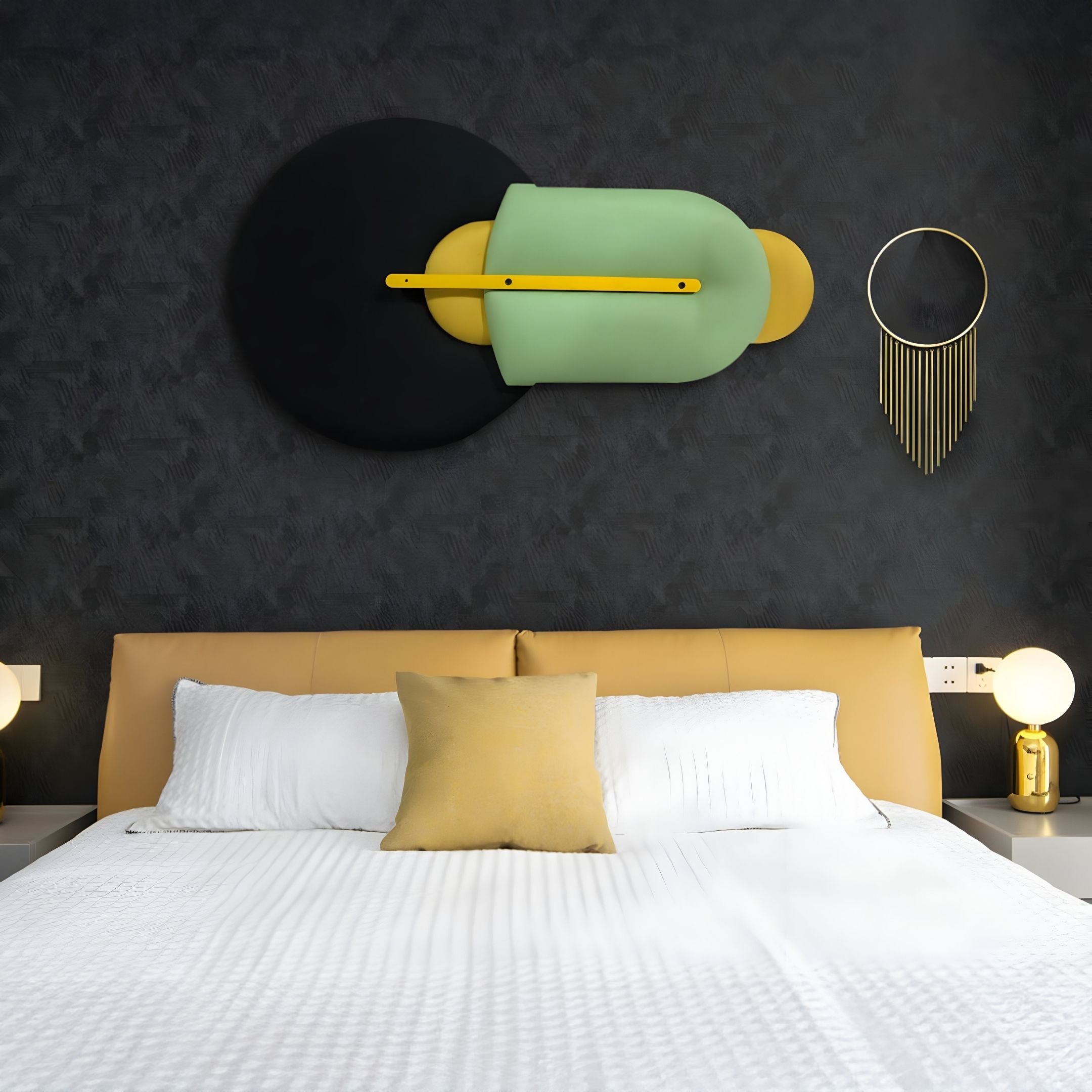 Modern bedroom with a tan upholstered bed, white bedding, gold accent pillow, Solvia Green & Yellow Layered Geometry 3D Wall Art by Giant Sculptures above the bed, and two round bedside lamps on either side.