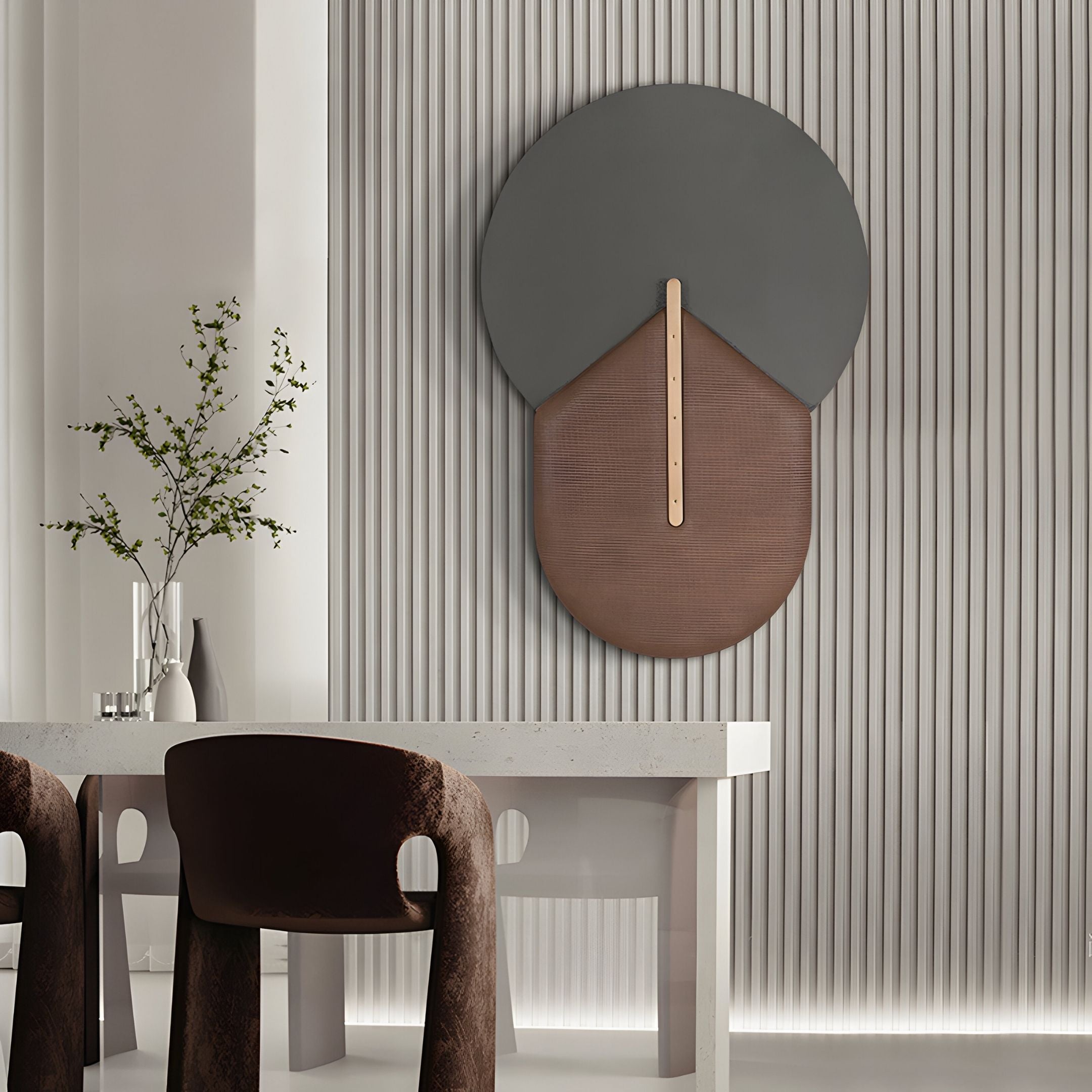 A modern dining area with a white table, brown upholstered chairs, a minimalist vase with branches, and the Solvia Brown & Grey Layered Geometry 3D Wall Art by Giant Sculptures set against vertical white paneling.