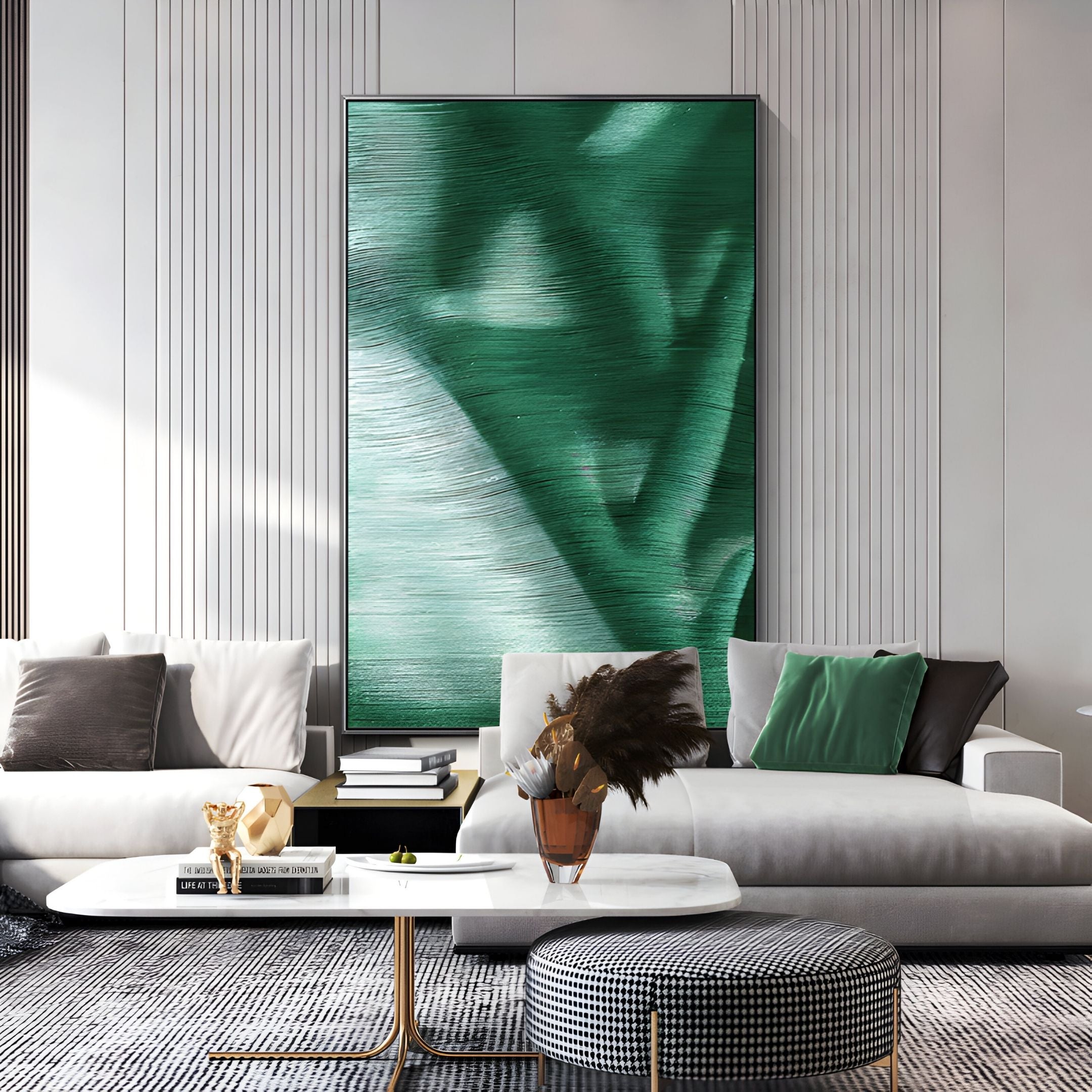 A modern living room features a light gray sofa, green and black cushions, a white coffee table with decor, and the Giant Sculptures Rivara Emerald Flow Hand-Painted Rope 3D Wall Art. The space is bright with elegant minimalist contemporary style.