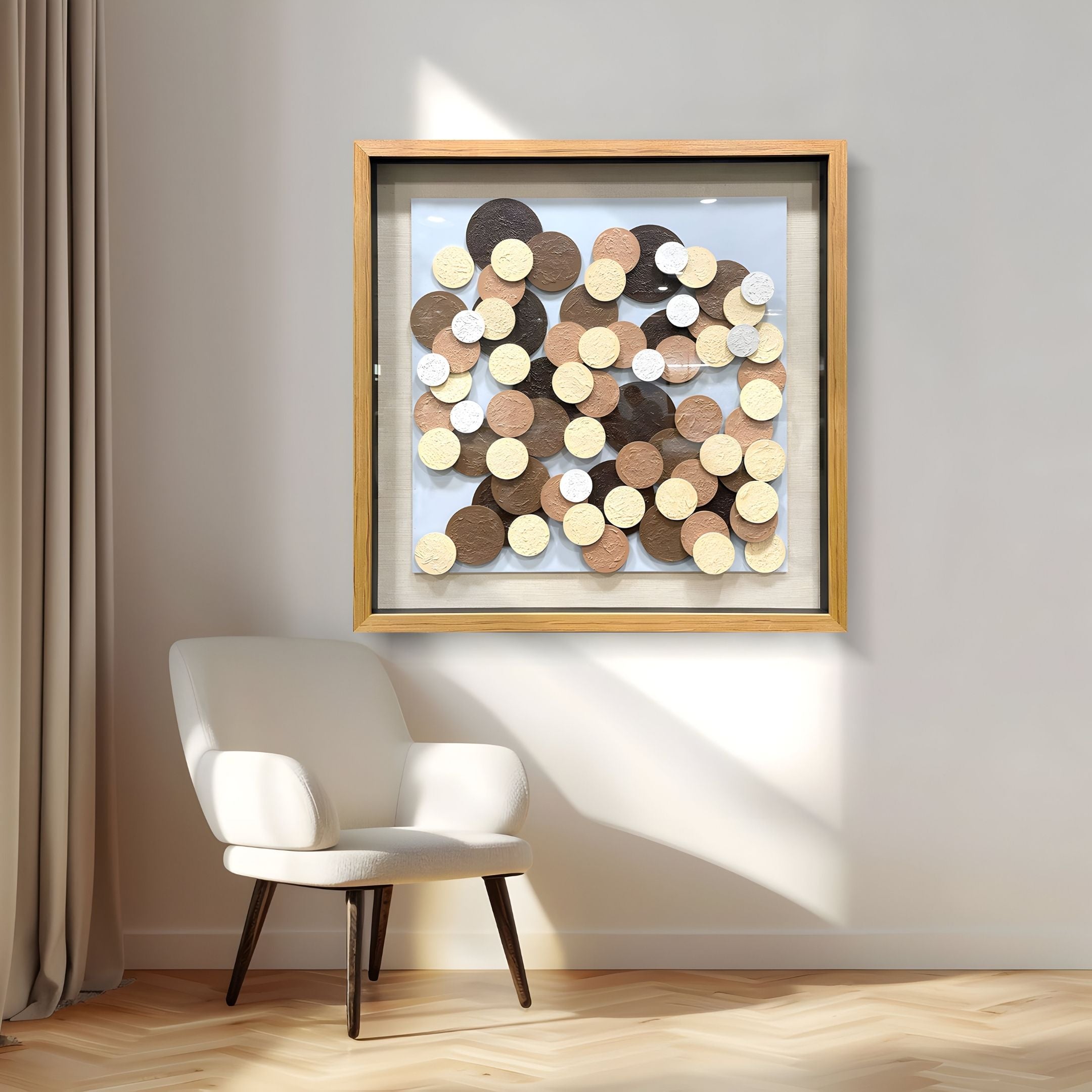 A modern white armchair sits beside a window with beige curtains, under the Giant Sculptures Circona Neutral Tone Layered Disc Wood 3D Wall Art, featuring overlapping wooden discs in brown, beige, and cream within a light wood frame.