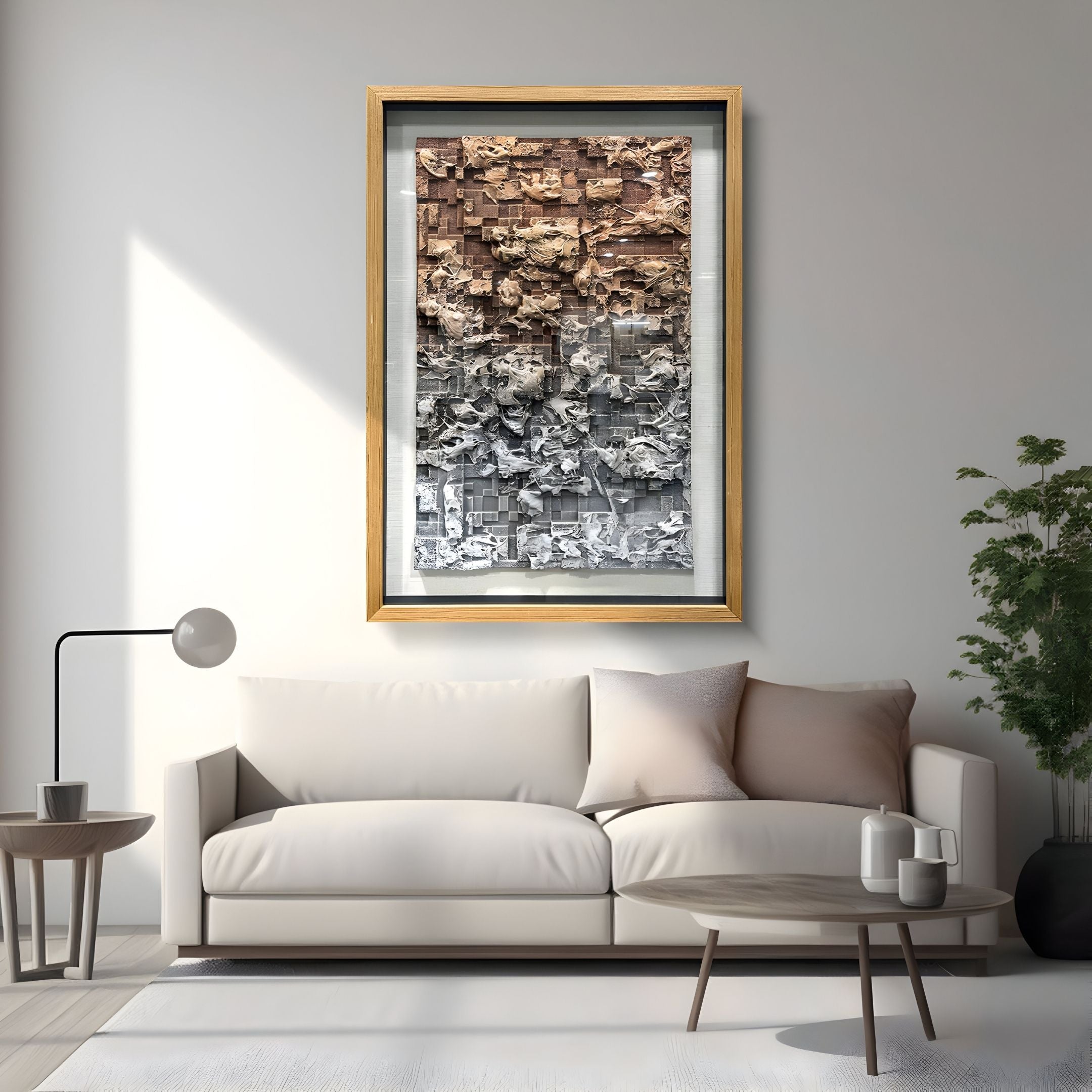 A modern living room with a beige sofa, floor lamp, round wooden coffee table, and Giant Sculptures’ Terracend Beige & Grey Textured Wood Framed 3D Wall Art. A potted plant sits beside the sofa.