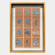 The Agliera Aqua Crystal Shard Grid Framed 3D Wall Art by Giant Sculptures features 12 shiny, silver-blue abstract relief tiles on nude-pink squares, set in a beige background and wooden frame in a modern 3x4 grid design.