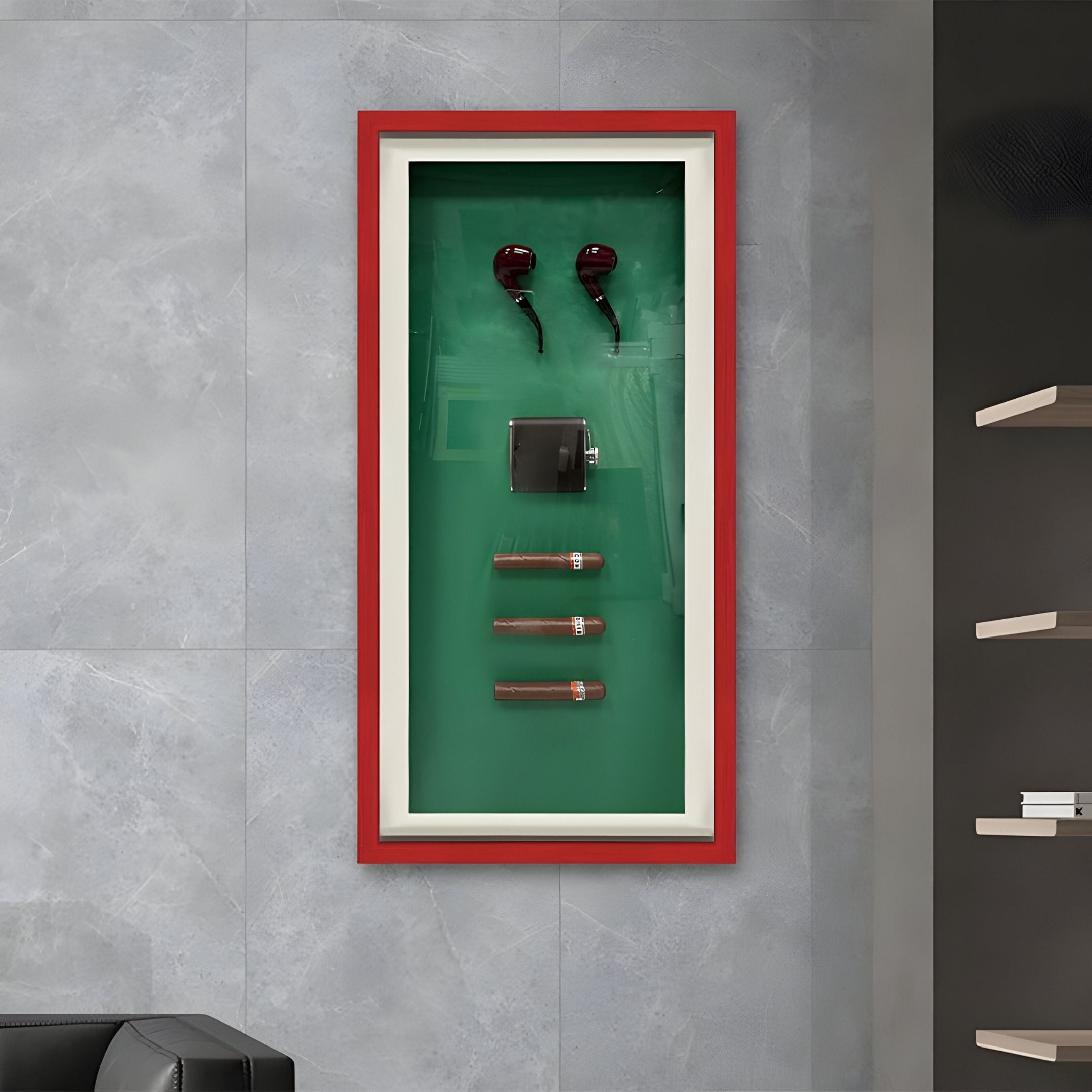 The Cavendor Pipe & Cigar Green Framed Wall Art by Giant Sculptures features two smoking pipes, a black lighter, and three cigars on a green background with a red border, mounted on a gray tiled wall beside floating shelves.