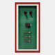 The Cavendor Pipe & Cigar Green Framed Wall Art by Giant Sculptures features two pipe-shaped objects, a metal flask, and three vertical cigars with a red border against a vivid green background.