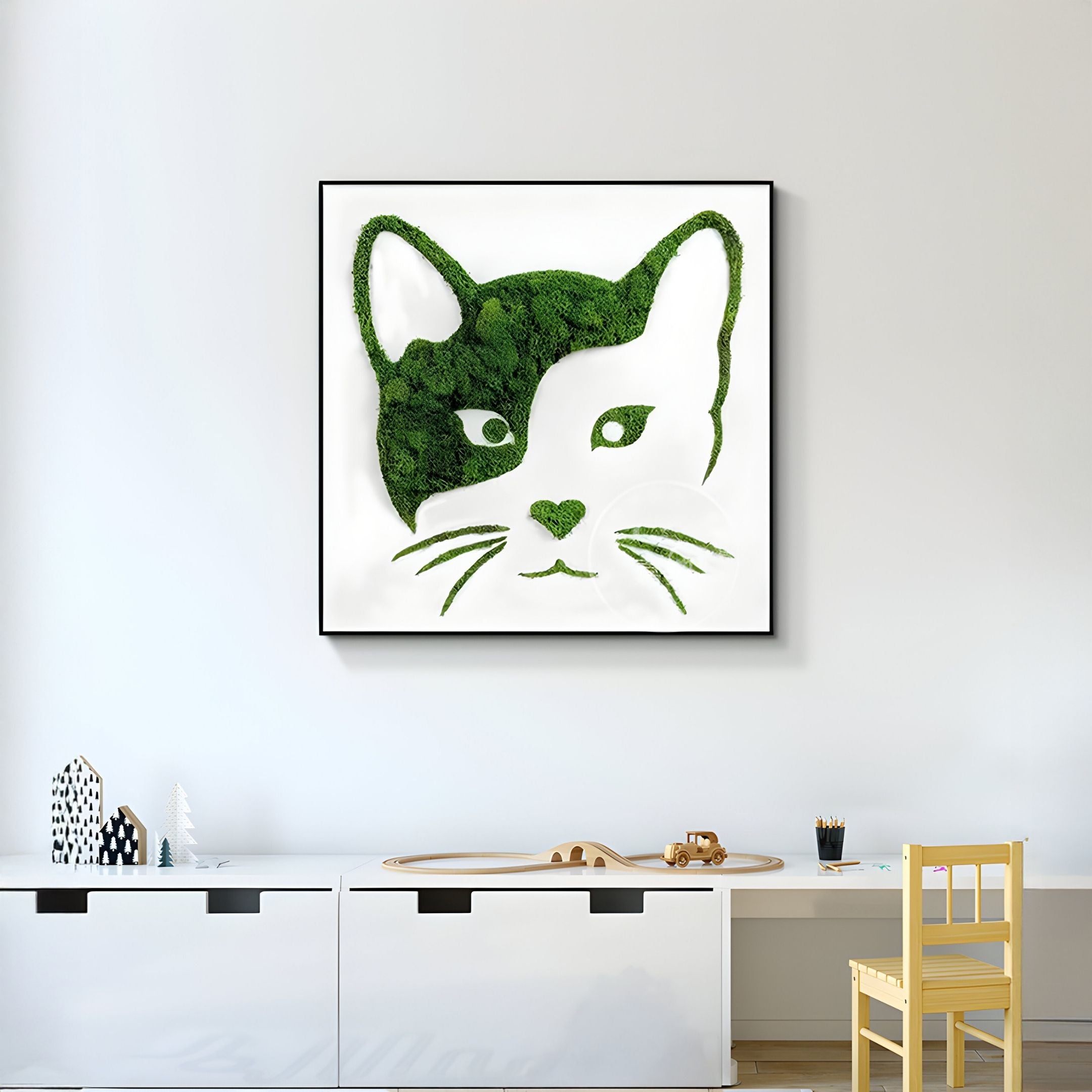 A minimalist room with white furniture, a small yellow chair, and Giant Sculptures’ Verdifable Square Green Cat Portrait Moss 3D Wall Art displayed on the wall.
