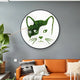 A modern living room showcases the Verdifable Round Green Cat Portrait Moss 3D Wall Art by Giant Sculptures, a brown leather sofa with patterned cushions, and a tall green plant for a touch of Scandinavian decor.