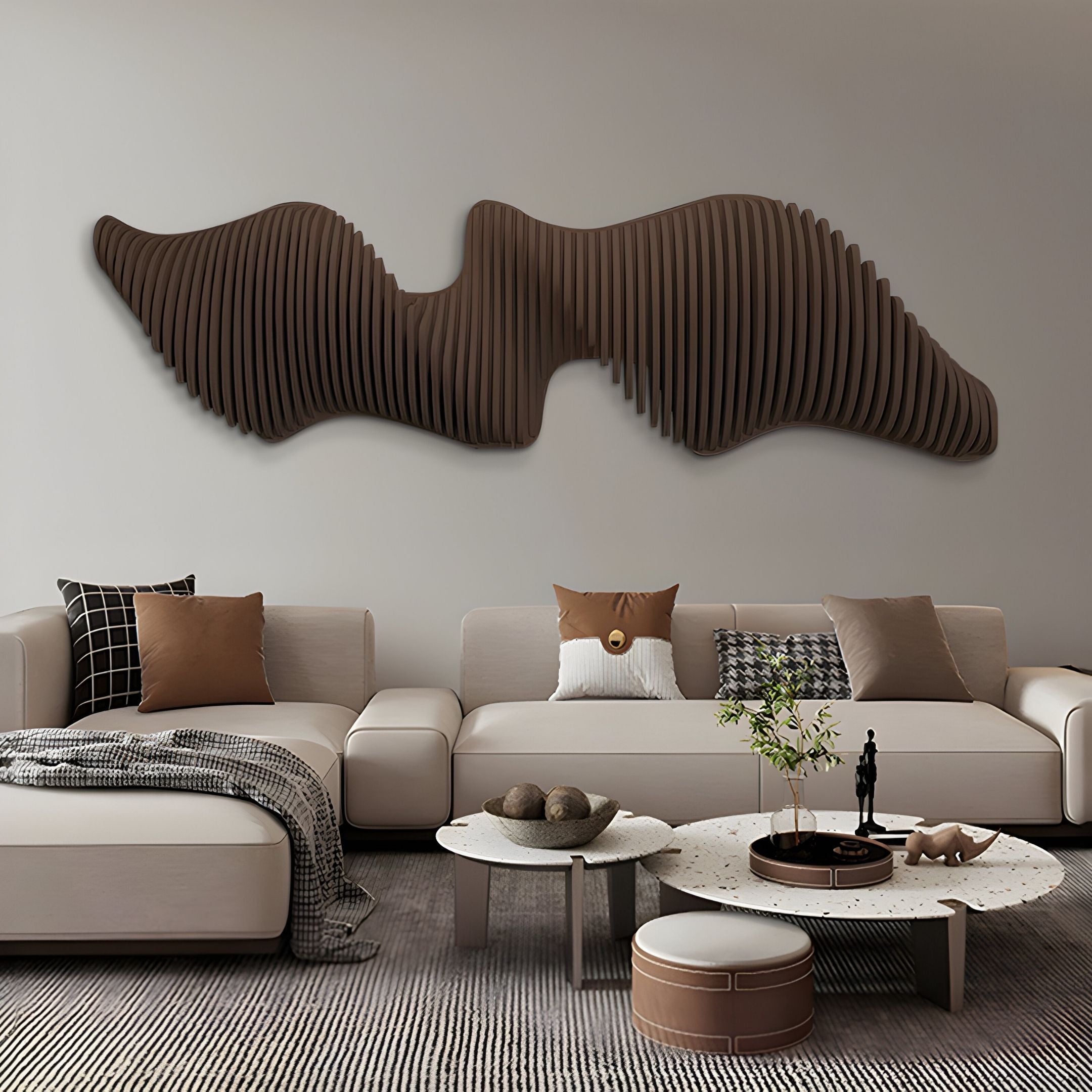 A modern living room with beige sofas, brown and black accent pillows, a round coffee table with decor, and the Aeravox Dark Brown Waveform Sculptural 3D Wall Art by Giant Sculptures as striking modern wall decor above the couch.