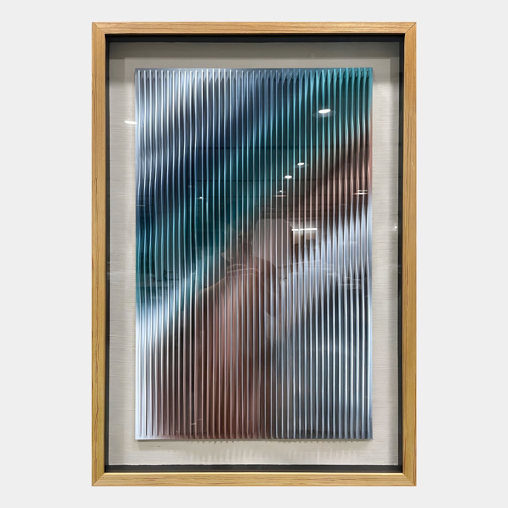 The Lentari Blue & Teal Gradient Wood Carving 3D Wall Art by Giant Sculptures features vertical, wavy ridges in blue, green, brown, and white. Its glossy surface reflects light and adds depth to your space.