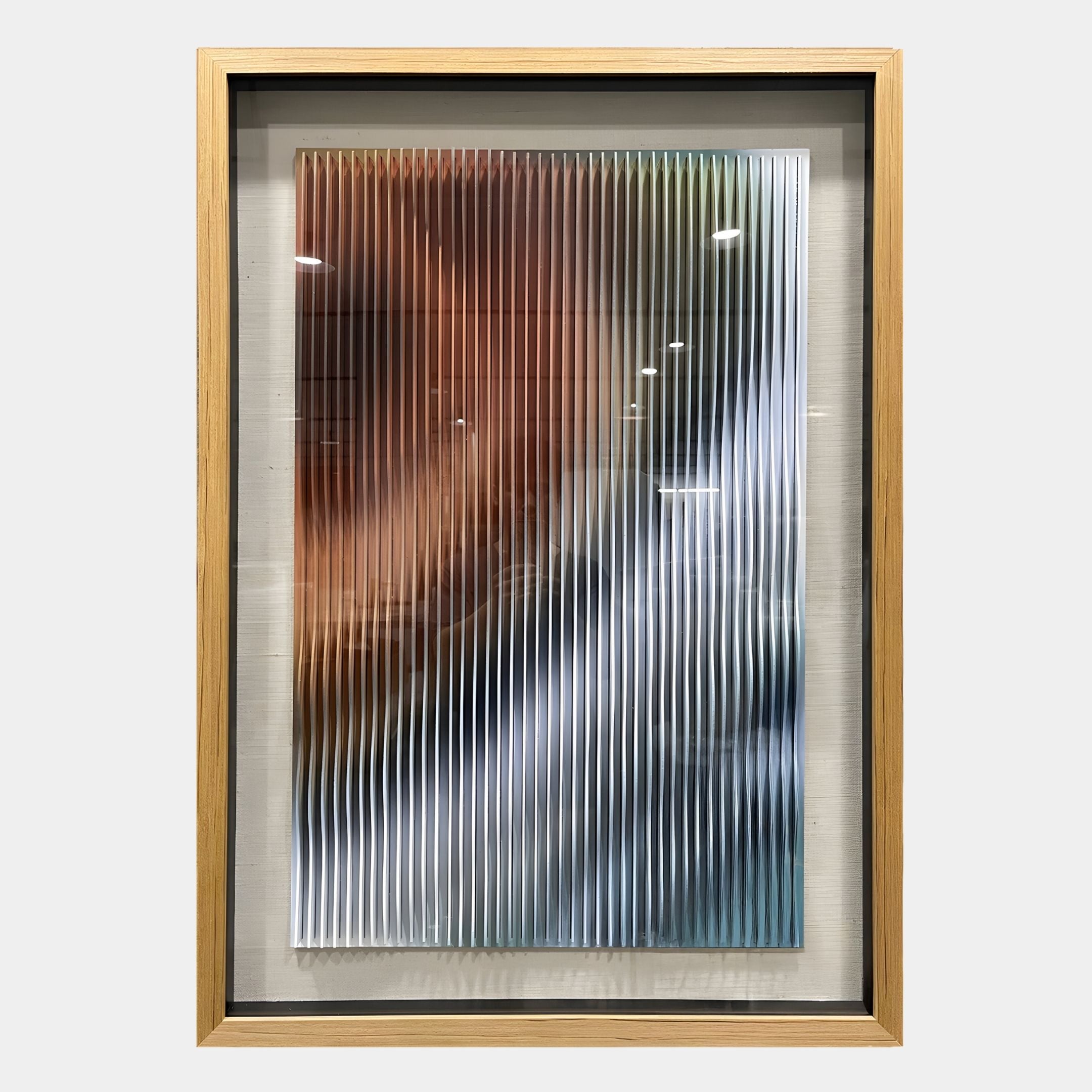 The Lentari Amber & Frosted Silver Gradient Wood Carving 3D Wall Art by Giant Sculptures features vertical, wavy white lines over blurred brown, blue, white, and black shades in a light wood frame—ideal for modern interiors.