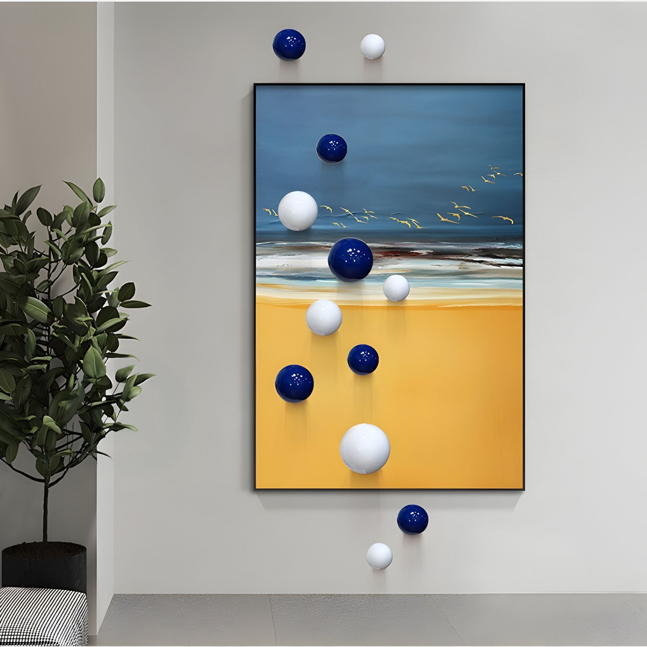 The Aerisphere Coastal Horizon Vertical 3D Wall Art With Metal Balls by Giant Sculptures showcases a yellow and blue abstract beach scene, with blue and white metal spheres floating in front and a green plant on the left.