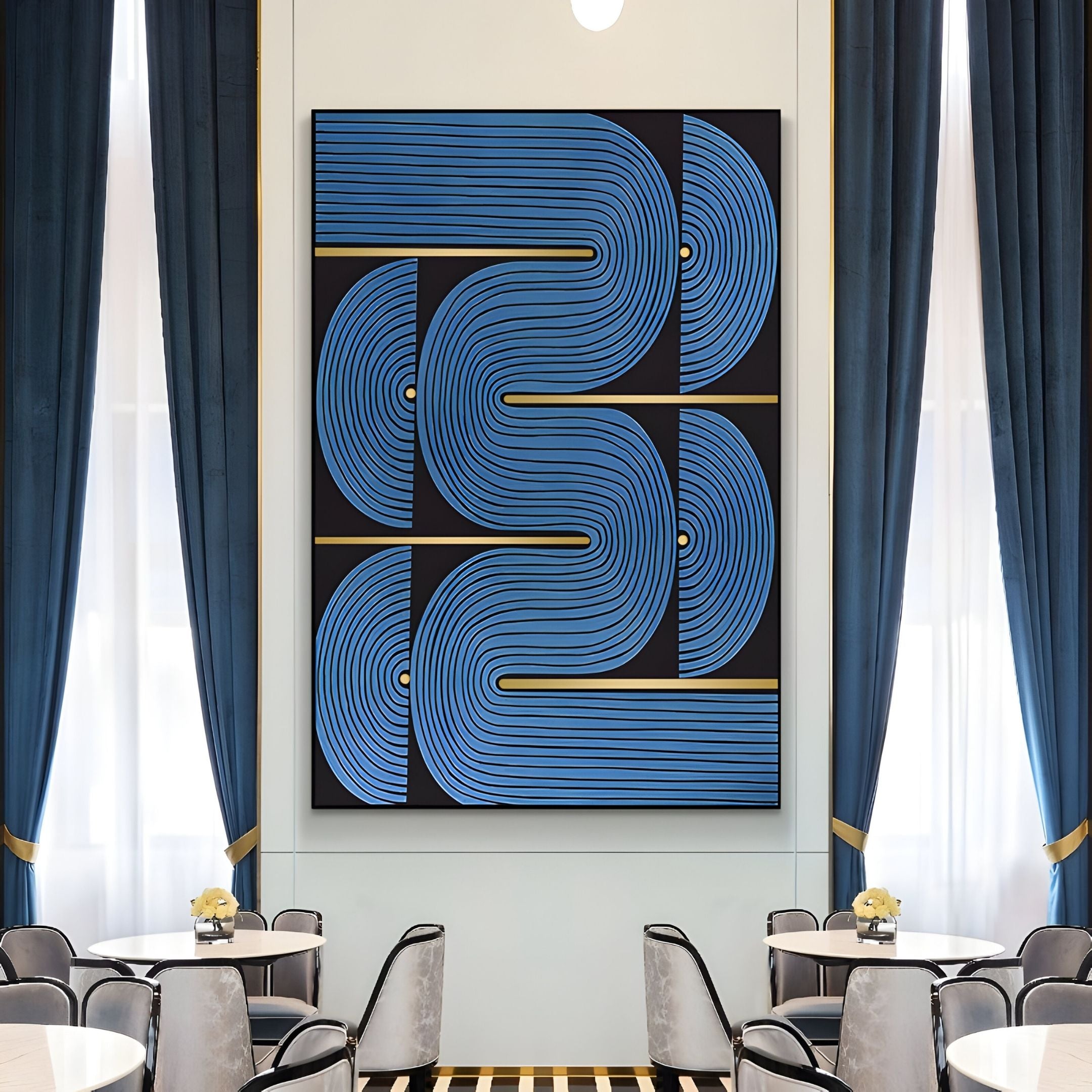 The Curvanta Blue Loop Geometric 3D Wall Art by Giant Sculptures features bold blue curved shapes on black, displayed between tall blue curtains in a modern dining area with white tables and chairs.