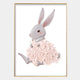 Blossomkin Bunny 3D Floral Wall Art by Giant Sculptures features a gray rabbit with pink-blushed cheeks and a soft pink flower petal skirt, making it perfect bunny nursery decor. Displayed on white with a thin gold frame.