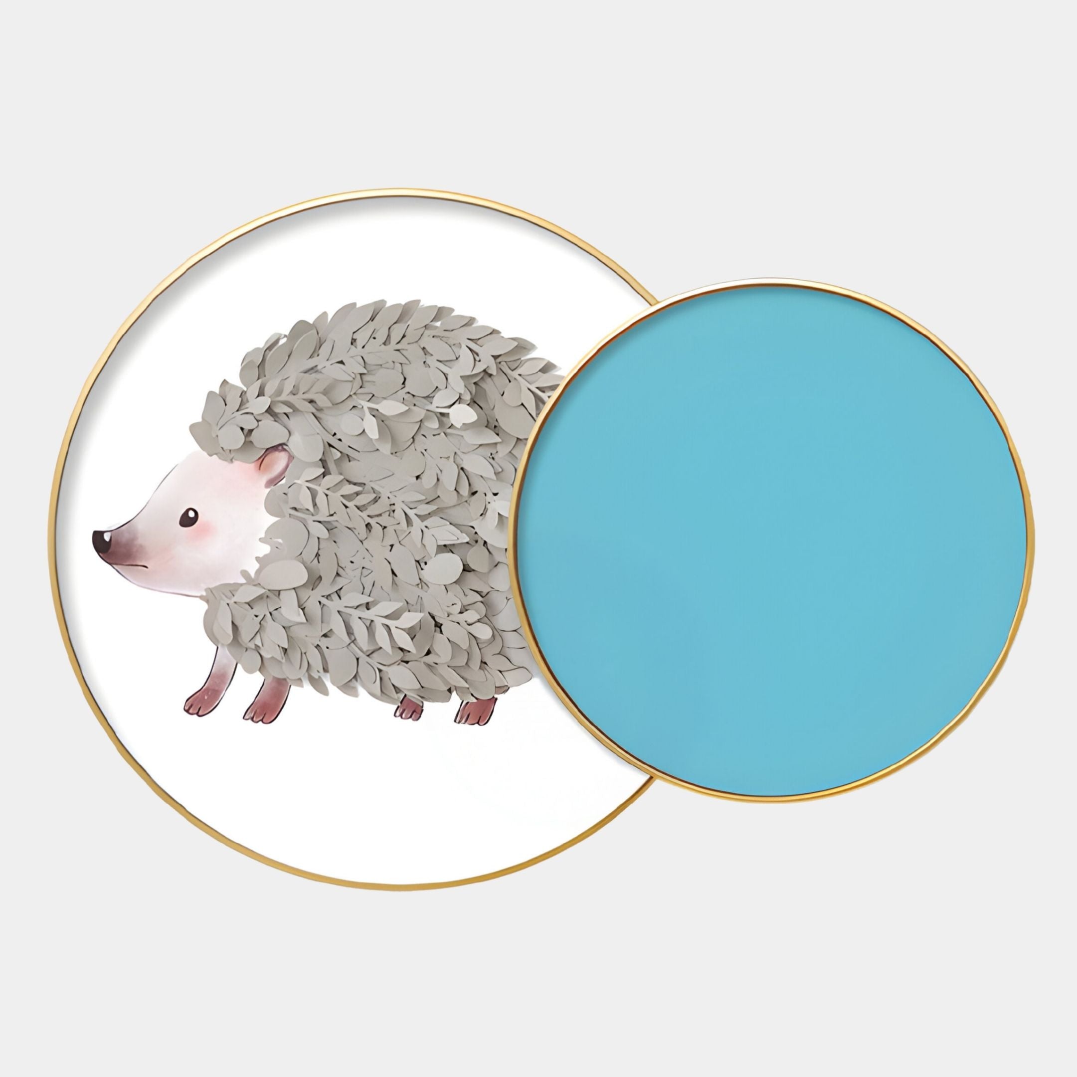 Blossomkin Blue Petal Hedgehog Kids 3D Wall Art by Giant Sculptures features a round plate with gray leaf hedgehog art, overlapped by a blue plate. Both have gold rims, ideal for whimsical nursery decor.