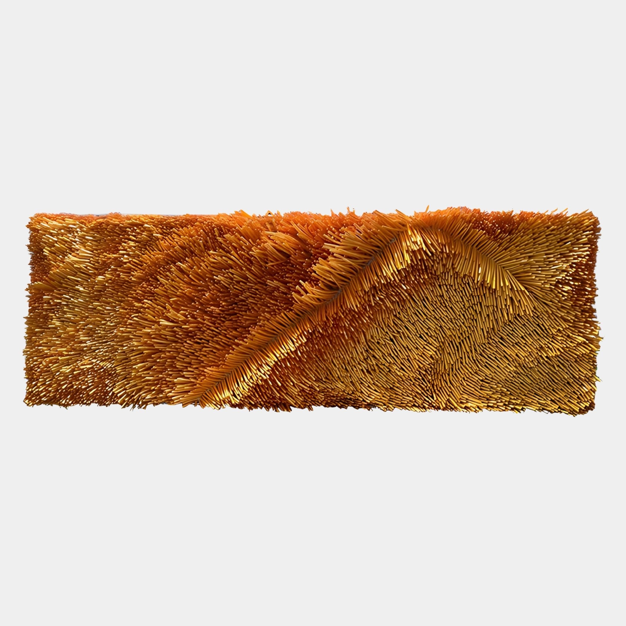 The Bristella Ember Gold Textured Linear Panel 3D Wall Art by Giant Sculptures features densely packed, golden-orange rods in a wave-like pattern, creating dynamic, modern sculptural decor for any space against a plain white backdrop.