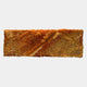 The Bristella Ember Gold Textured Linear Panel 3D Wall Art by Giant Sculptures features densely packed, golden-orange rods in a wave-like pattern, creating dynamic, modern sculptural decor for any space against a plain white backdrop.