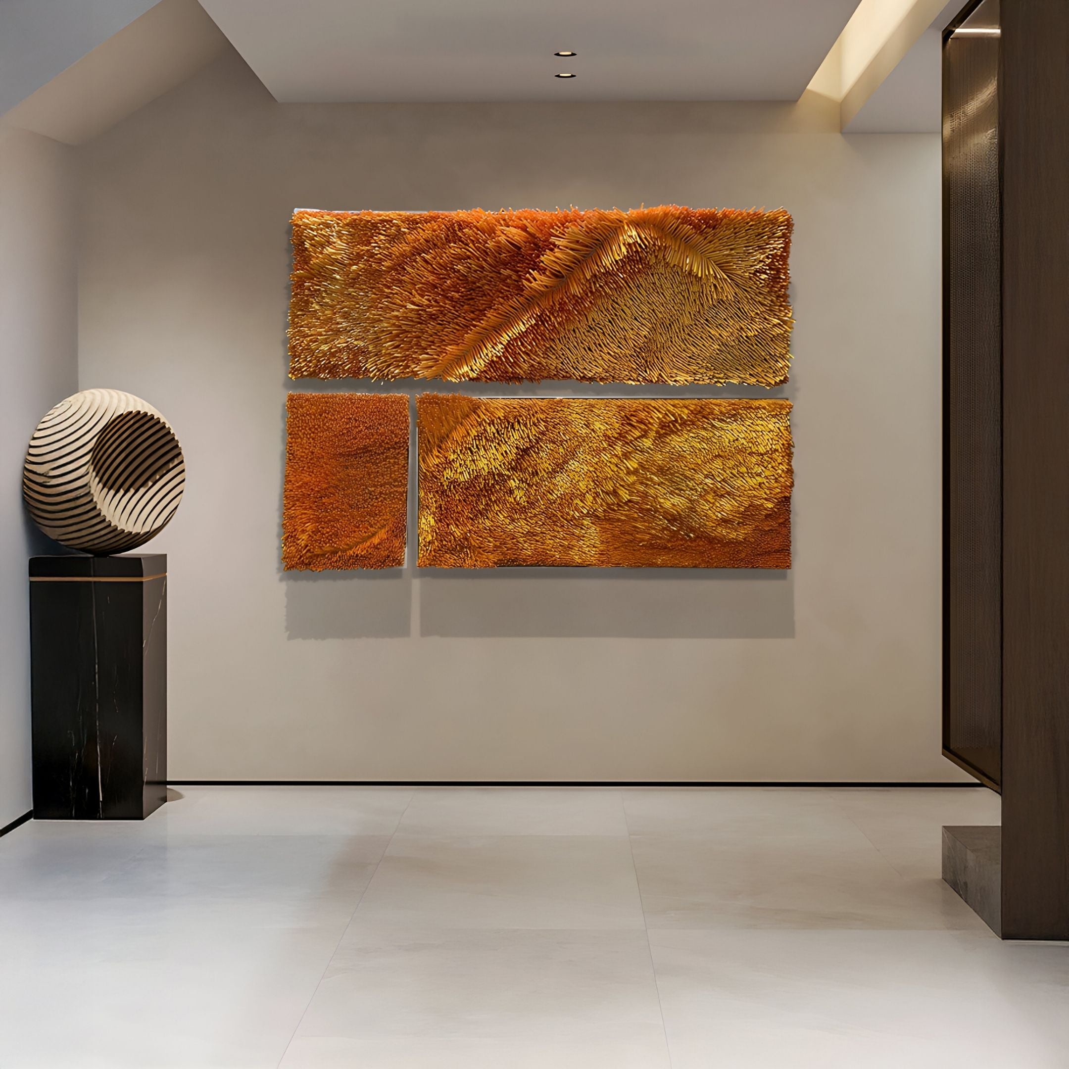 A modern hallway showcases the Bristella Amber Textured Vertical Panel 3D Wall Art by Giant Sculptures, paired with a sculptural striped sphere on a black pedestal. Neutral walls and minimalist design emphasize this bold contemporary artwork.