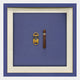 The Cavallero Blue Cigar & Cutter Framed Wall Art by Giant Sculptures showcases a yellow cigar cutter and brown COHIBA cigar on blue with a white mat and blue frame—ideal wall décor for cigar lovers.