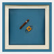 Giant Sculptures’ Cavallero Teal Cigar & Cutter Framed Wall Art features a striking cigar and yellow cutter on a blue backdrop—ideal as contemporary wall art or bold teal decor for modern interiors.