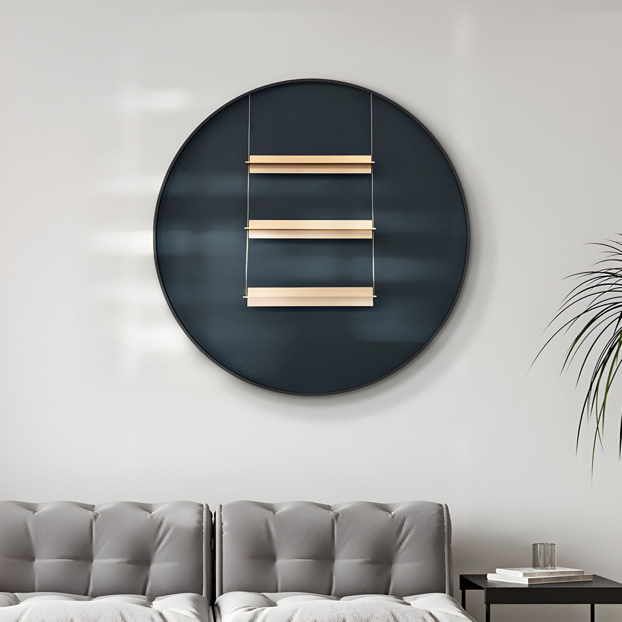 A modern living room with a light gray tufted sofa, the Straylight Charcoal Black Tiered Bar Round 3D Wall Art by Giant Sculptures on the wall, a side table with books, and a tall plant to the right.