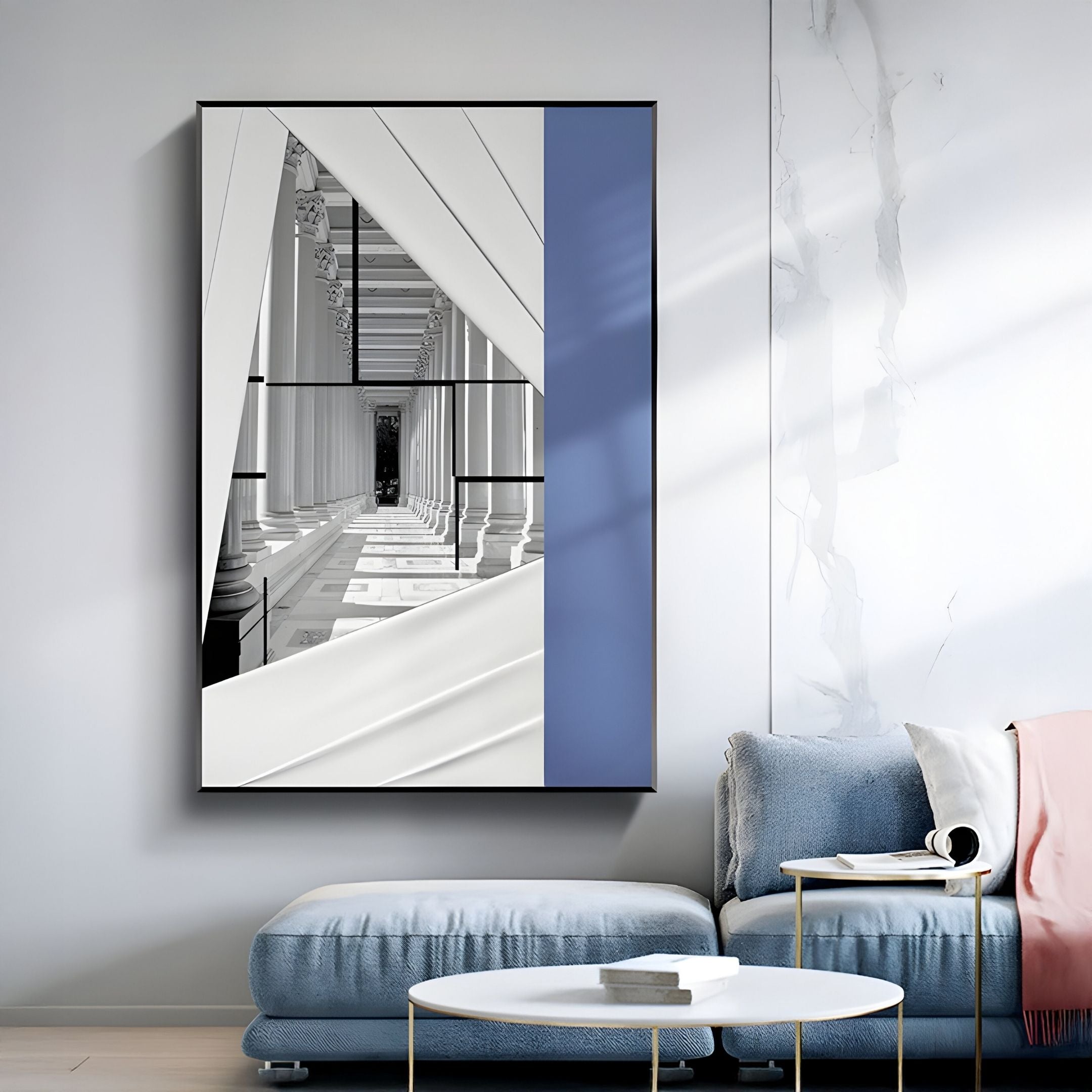 A modern living room with a light blue sofa and round white coffee table features the Arclustre Blue & White Classical Column Passage 3D Wall Art by Giant Sculptures—perfect for contemporary interiors.