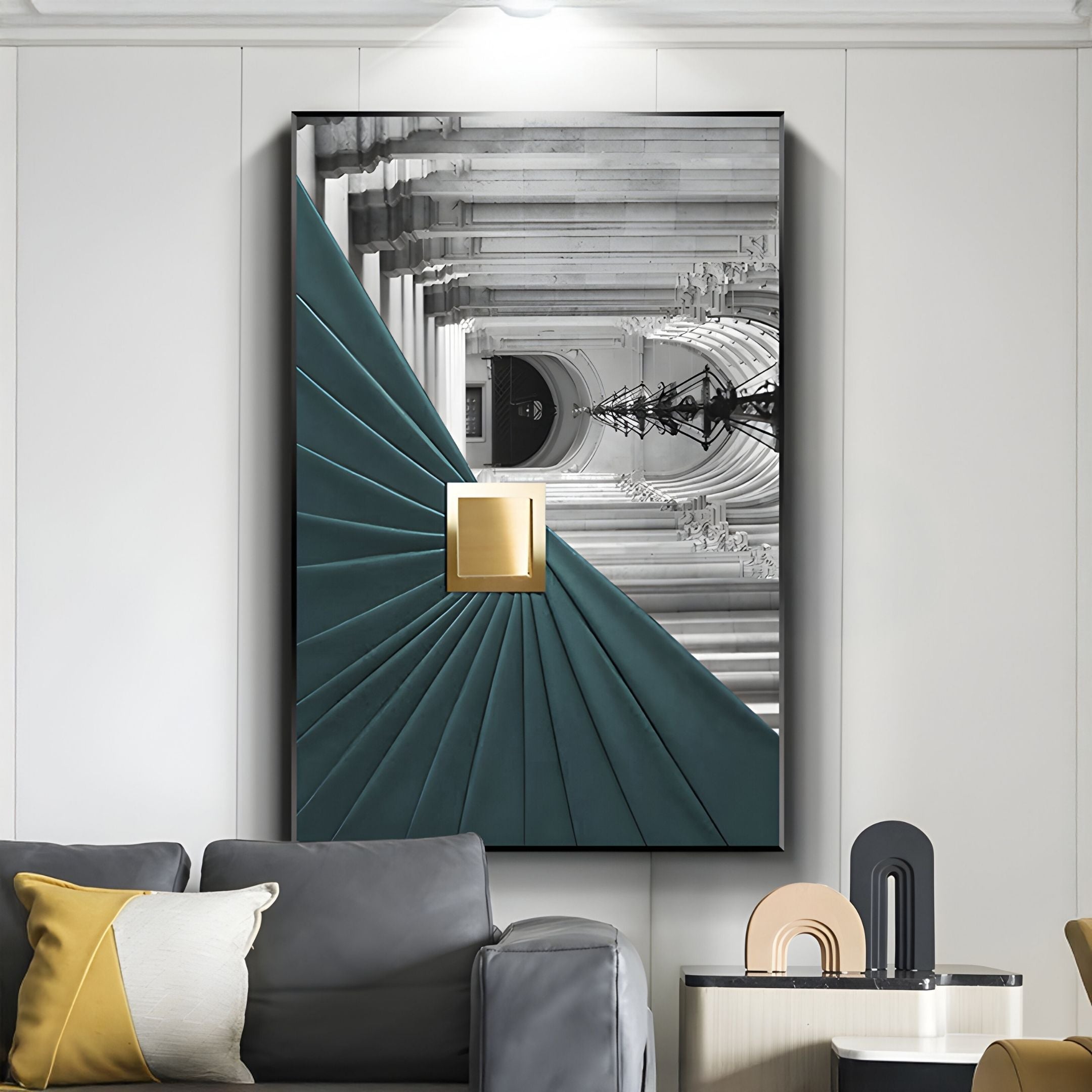 A modern living room showcases the Arclustre Teal Pleated Leather Architectural 3D Wall Art by Giant Sculptures, featuring teal panels, a central gold square, and a black-and-white photo backdrop above a gray sofa with pillows.