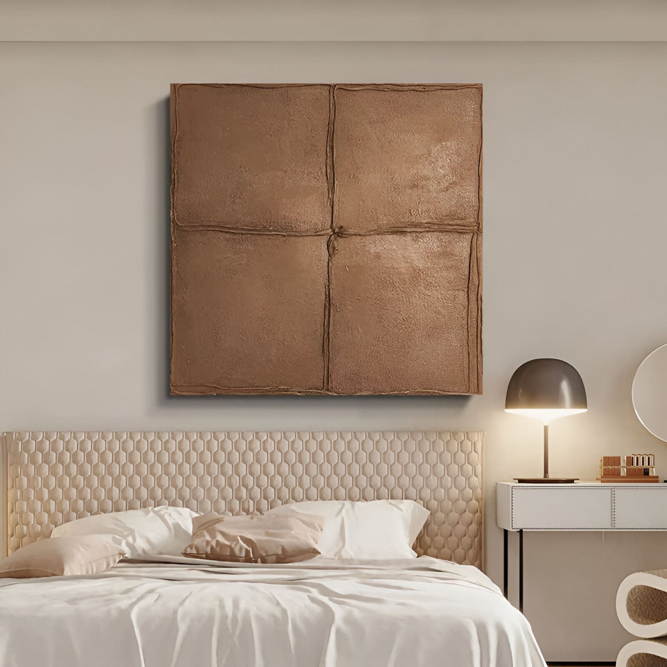 Minimalist bedroom with a cream tufted headboard, unmade bed, white nightstand, modern lamp, and Giant Sculptures’ Terracrecta Cocoa Brown Painted Textured Square 3D Wall Art featuring four panels above the bed.