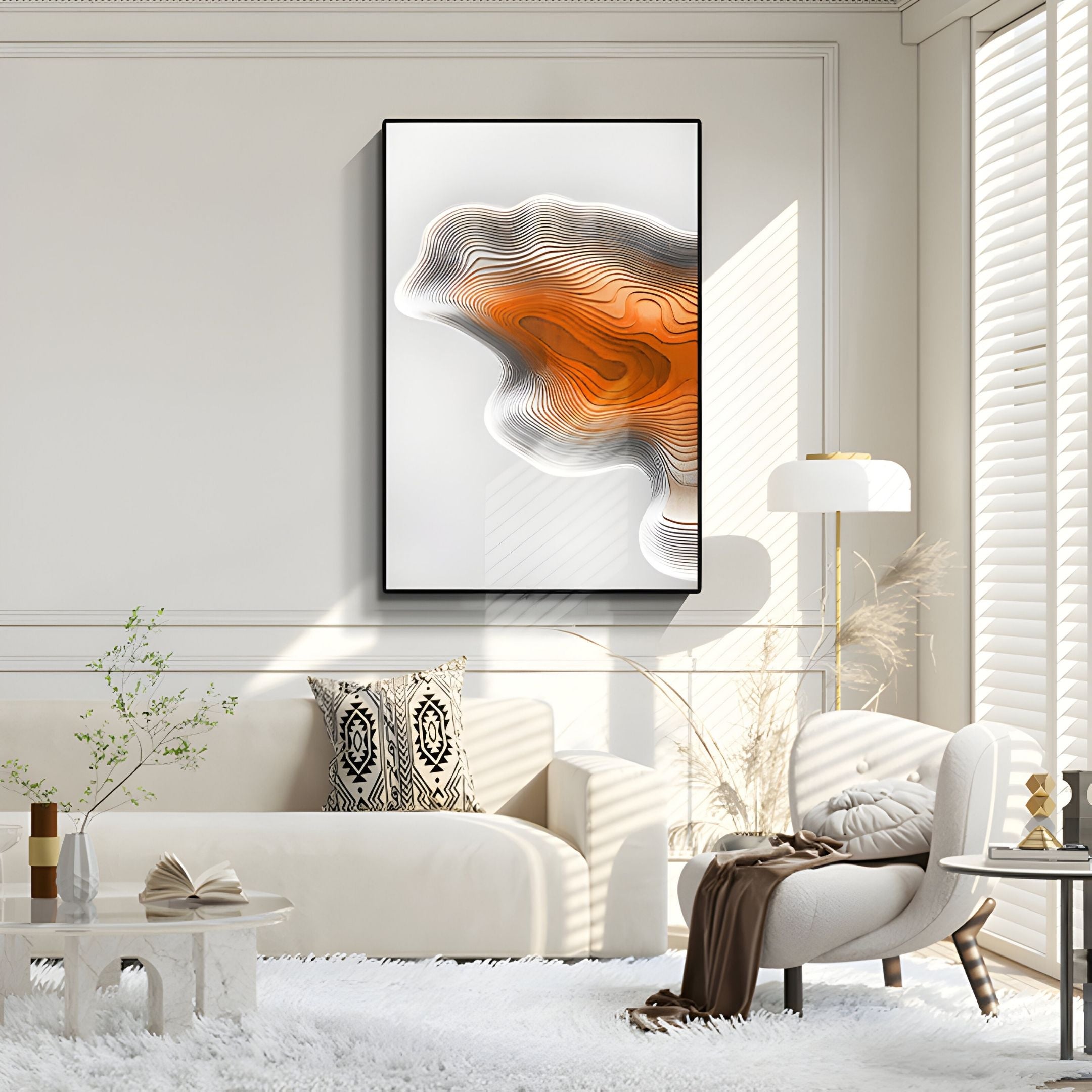 A modern living room with a white sofa, patterned pillows, a white lounge chair, and floor lamp features Giant Sculptures' Stratona Orange Contour Layered Wood Relief 3D Wall Art. Sunlight through white blinds highlights the dimensional piece.