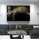 A modern living room featuring a black leather sofa, glass coffee table with two gold crane sculptures, and the Auravalor Gold Leopard Crystal Porcelain 3D Wall Art by Giant Sculptures—luxury decor with a golden leopard leaping over a dark abstract background.
