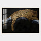 Auravalor Gold Leopard Crystal Porcelain 3D Wall Art by Giant Sculptures features a striking gold and black leopard lounging on a branch against a dark backdrop, highlighted by a glass-framed window reflection for luxurious decor.