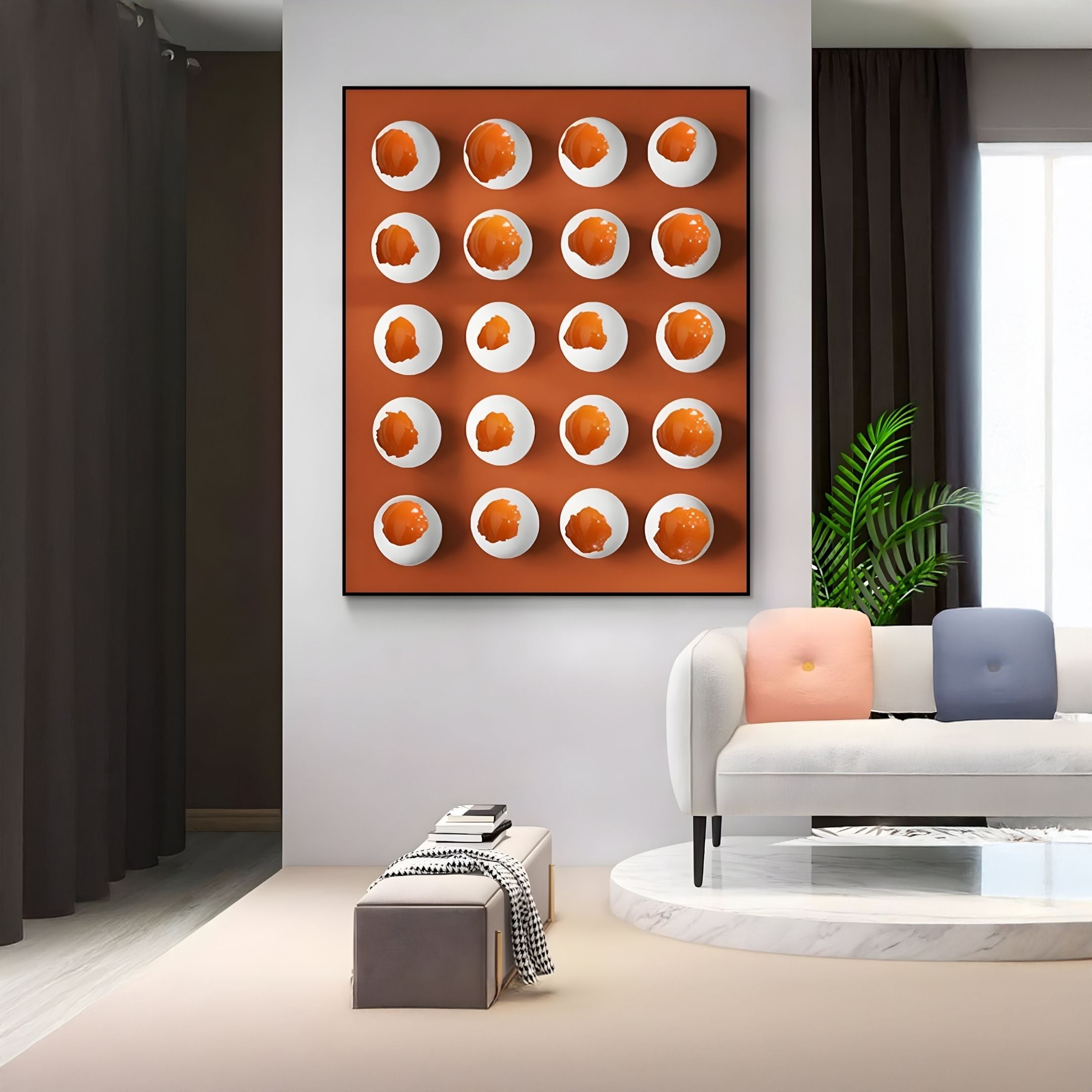 A modern living room with a white couch, colorful cushions, a plant, and Giant Sculptures' Orbivelle White & Amber Patch Sphere Panel 3D Wall Art. Sunlight streams through sheer curtains.