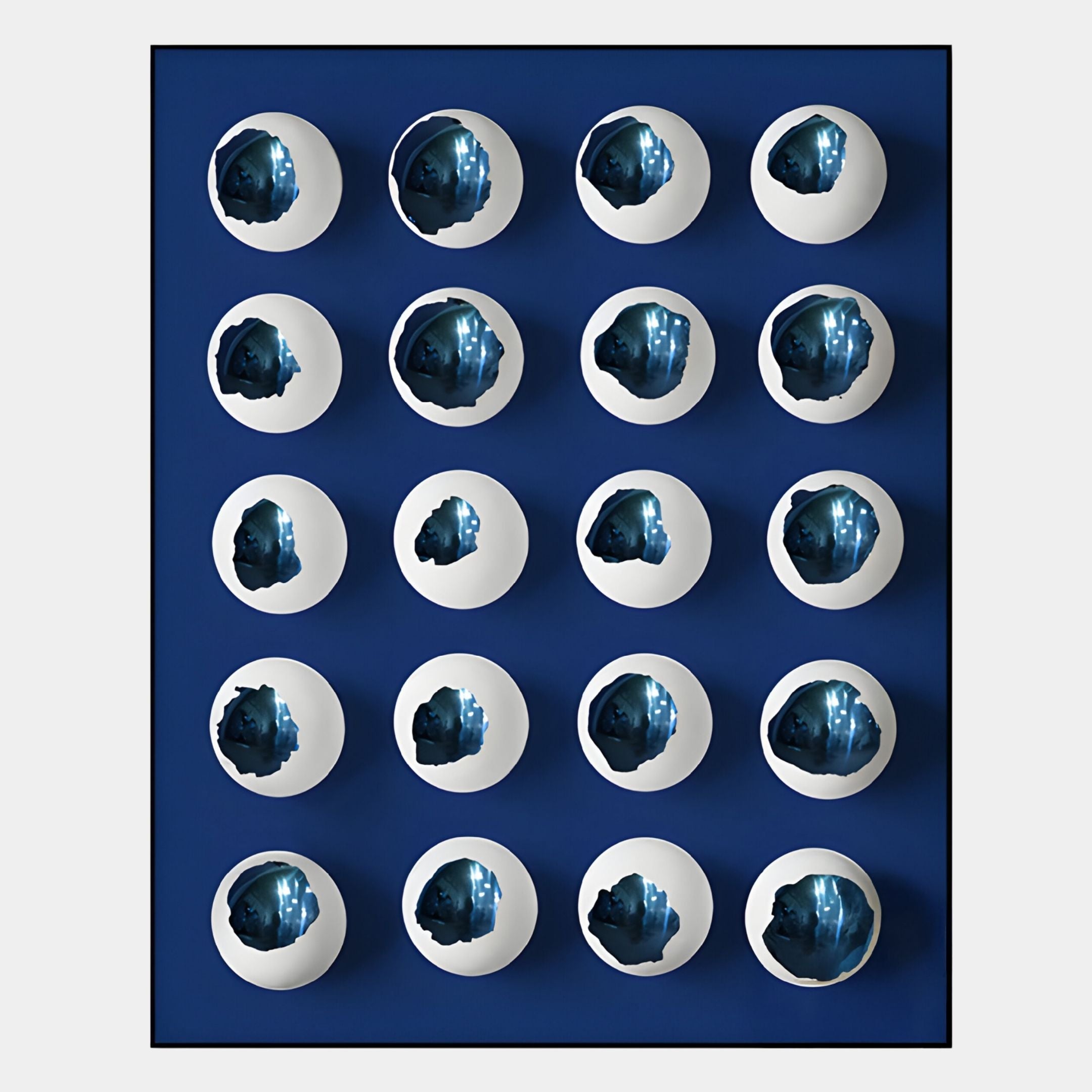 The Orbivelle White & Cobalt Patch Sphere Panel 3D Wall Art by Giant Sculptures features 20 white eggshell halves with jagged edges, revealing cobalt interiors, arranged symmetrically on blue for a bold Nordic-inspired effect.